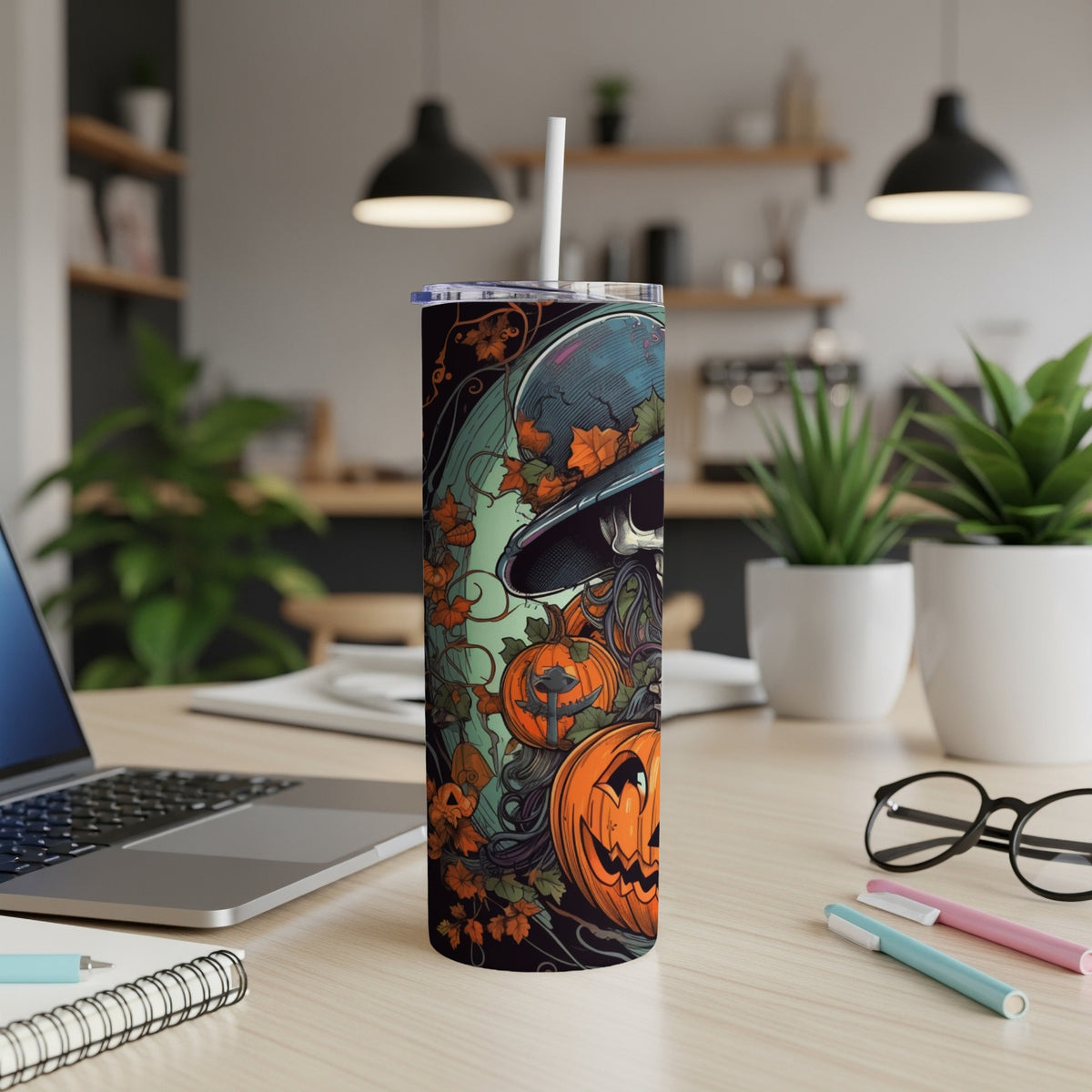 Halloween tumbler with skull, pumpkins, and autumn leaves design.