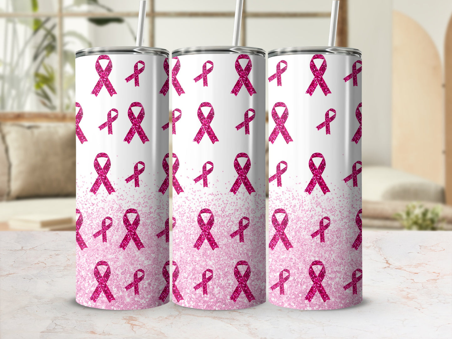 Three pink glitter cancer ribbon tumblers with straws, arranged in a row.