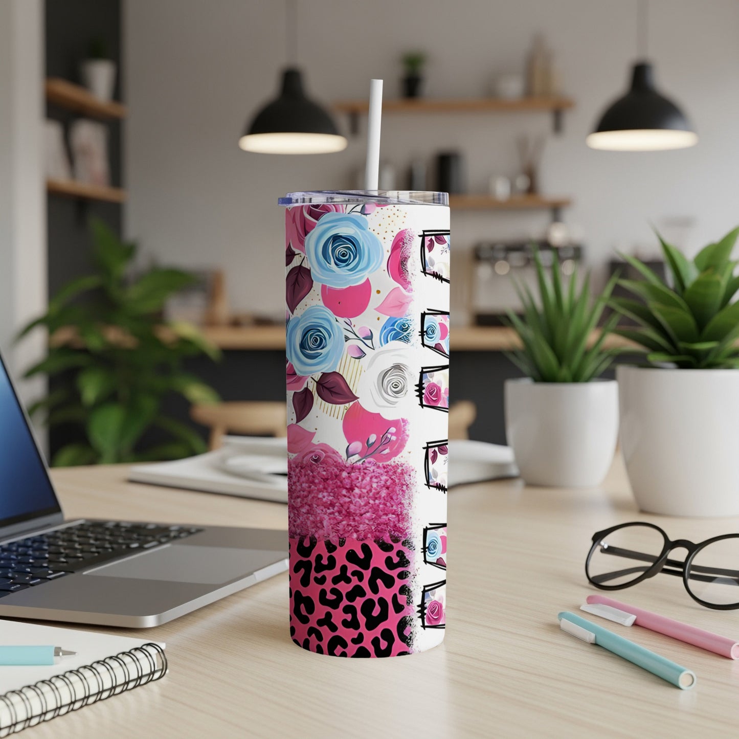 Tall tumbler with floral and leopard print, white lid, and straw.