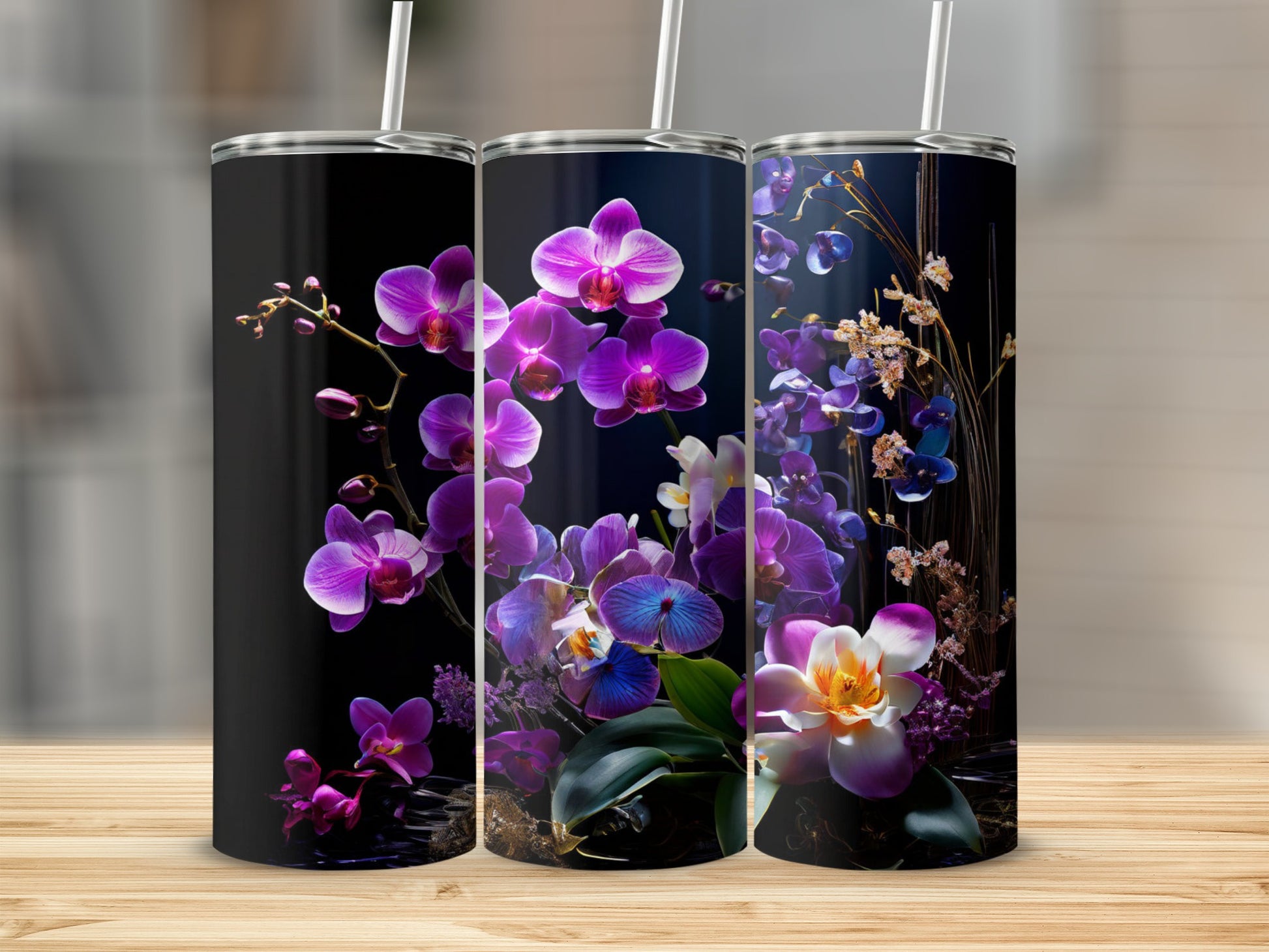 Three tumblers with purple and white orchids against a dark background.