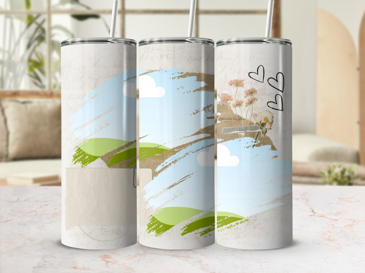 Three tumblers with a watercolor landscape and floral design with hearts.