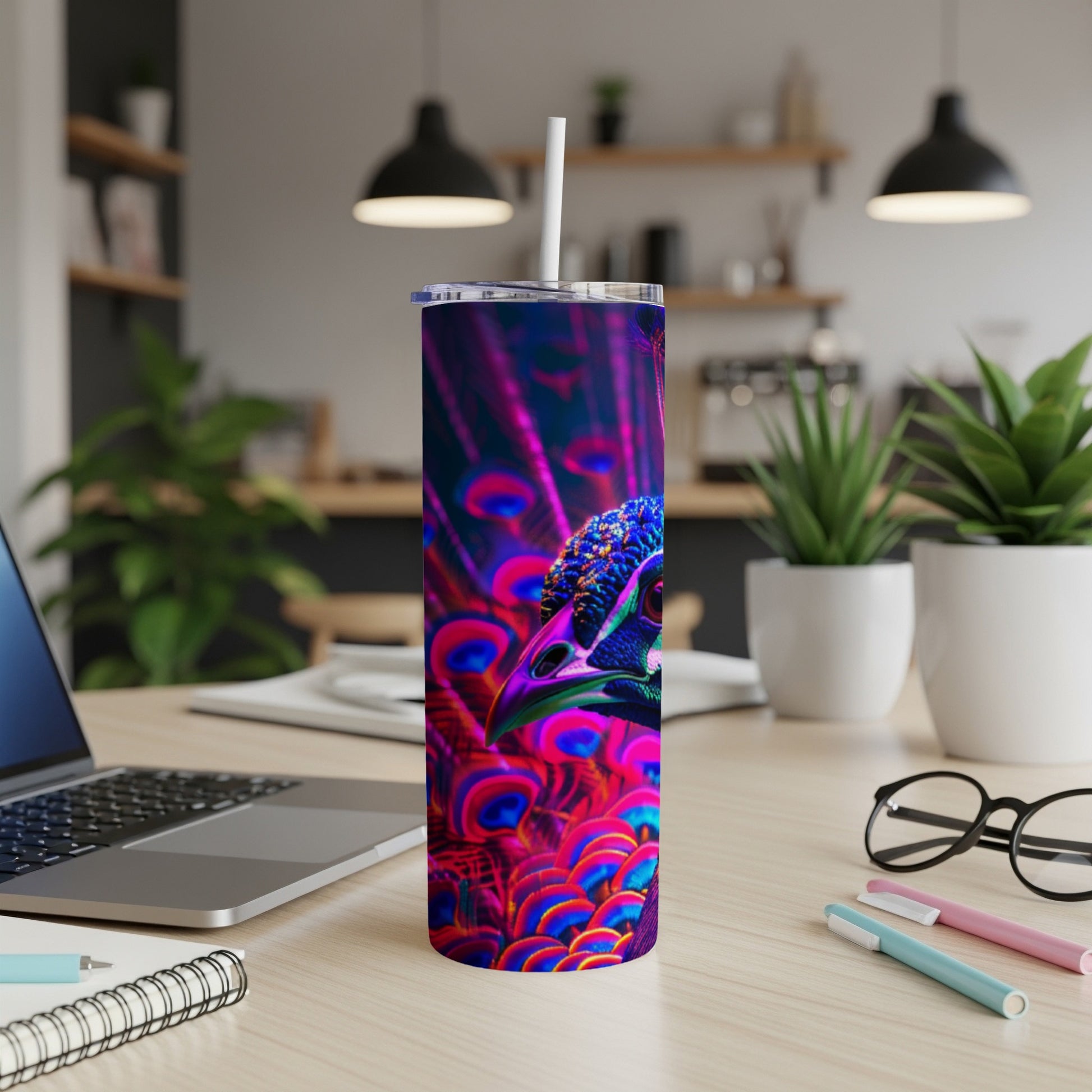Purple and teal peacock feather pattern on a skinny tumbler with white lid and straw.