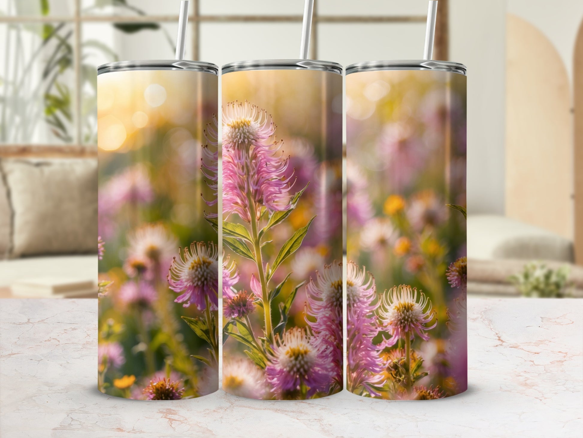 Three tumblers with a floral pattern of pink and white flowers.