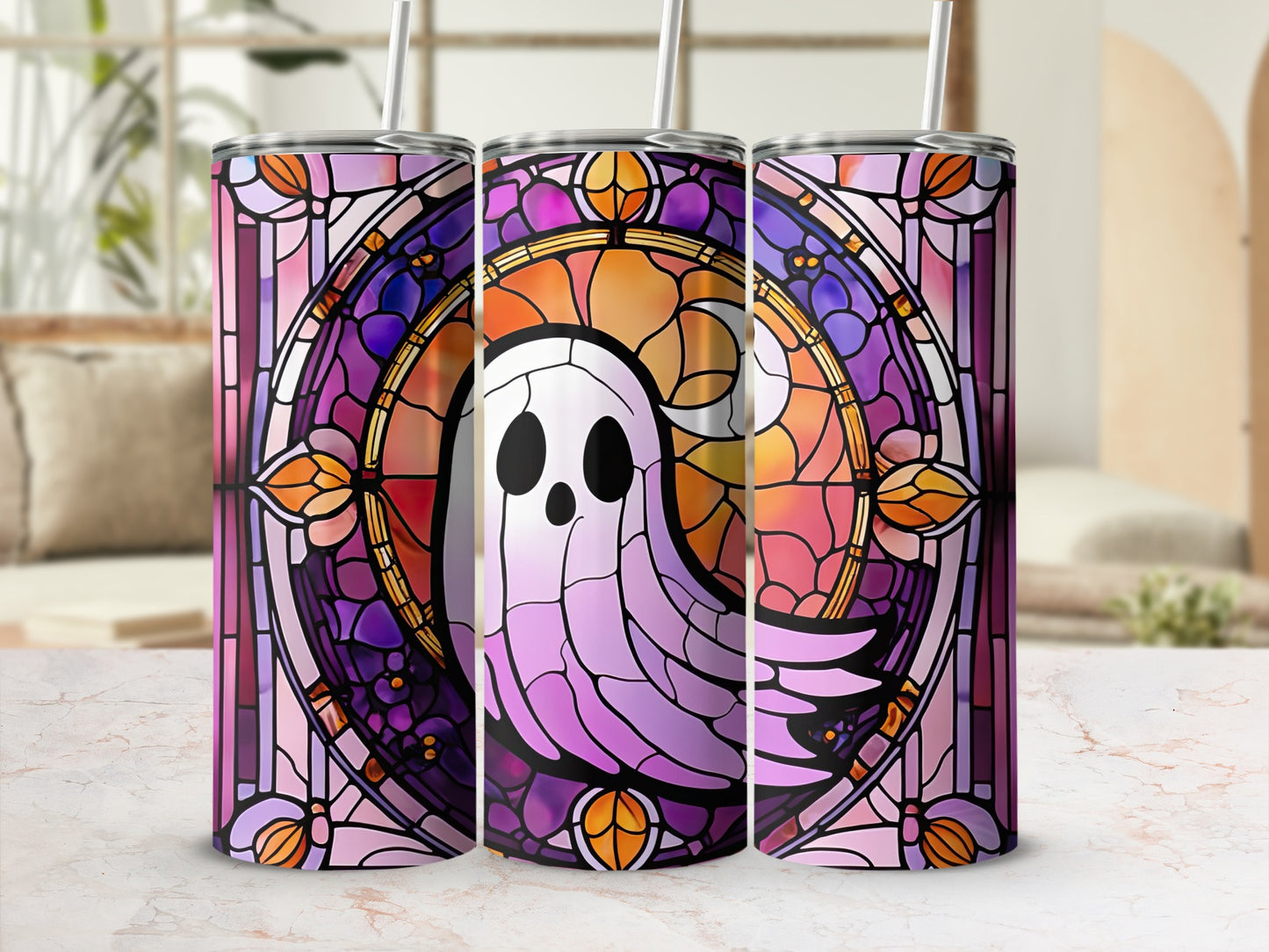 Three tumblers decorated with a purple, pink, and orange stained glass ghost design.