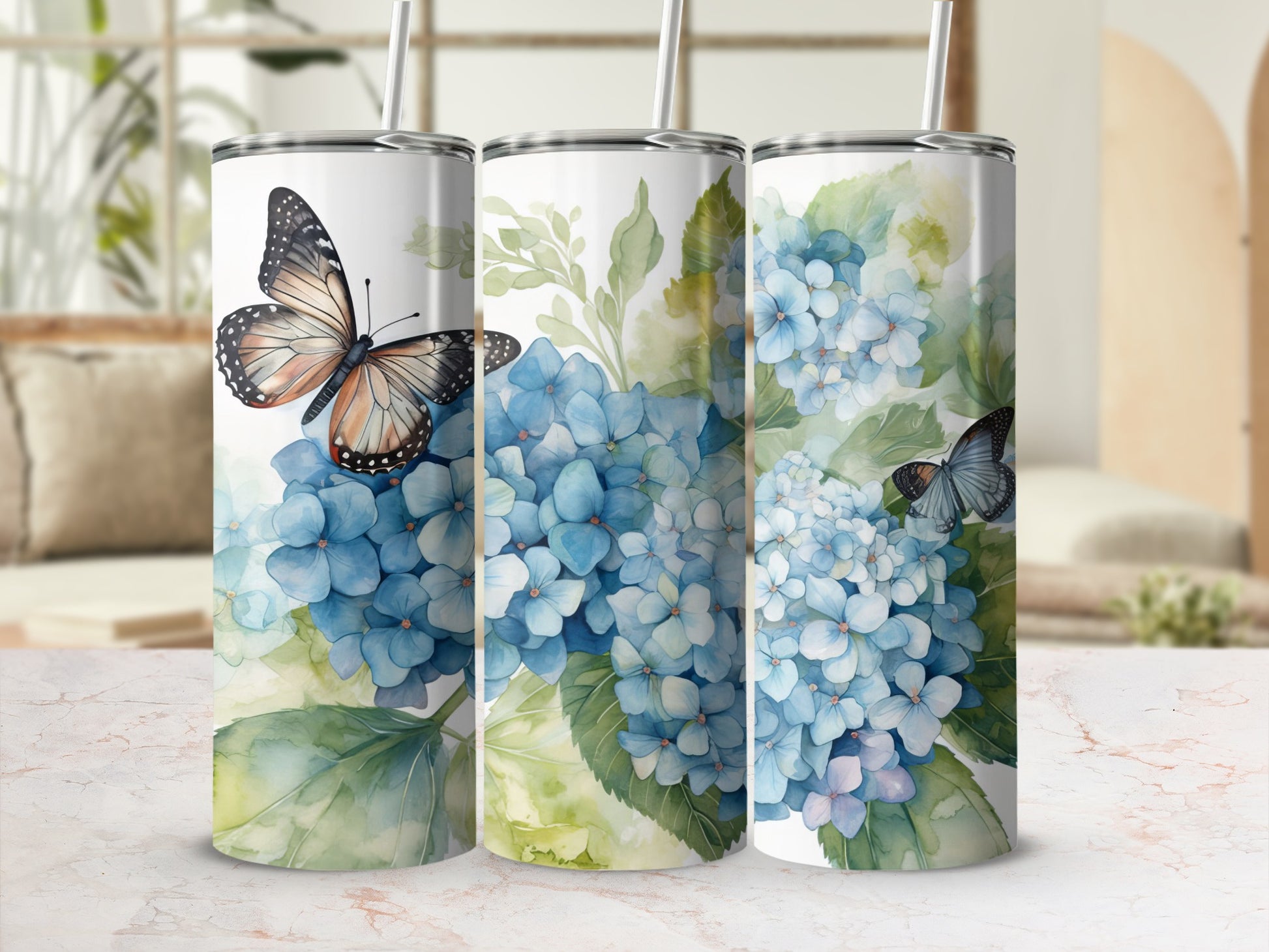 Three tumblers with watercolor hydrangeas and butterflies.
