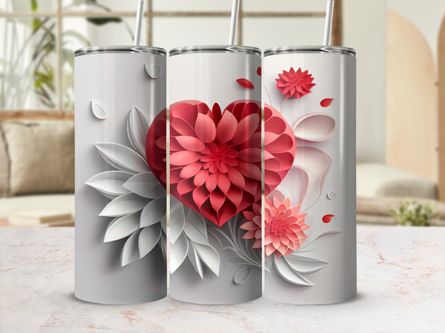 Three tumblers with floral heart designs and muted background.