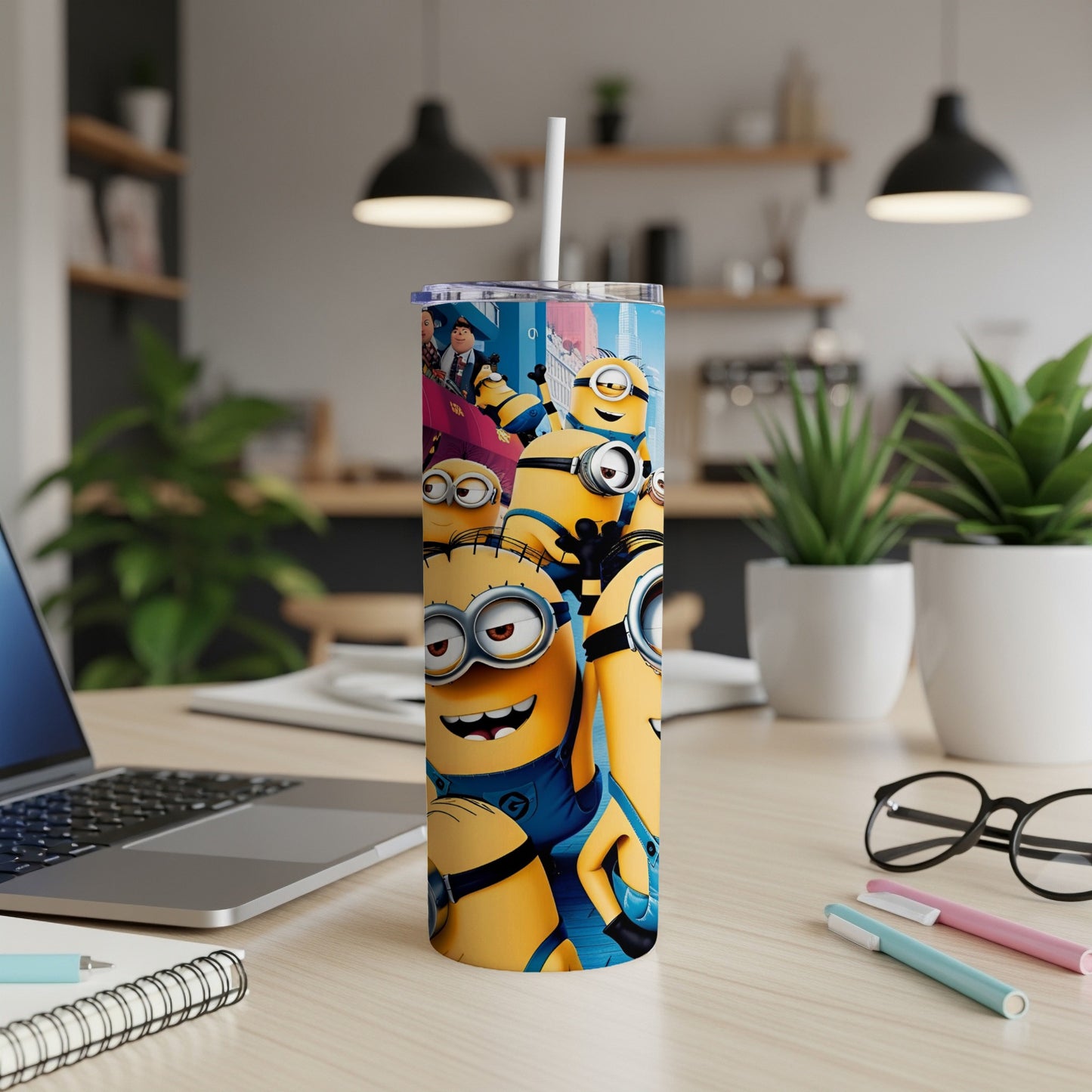 Minions characters on a tall, insulated tumbler with a straw.
