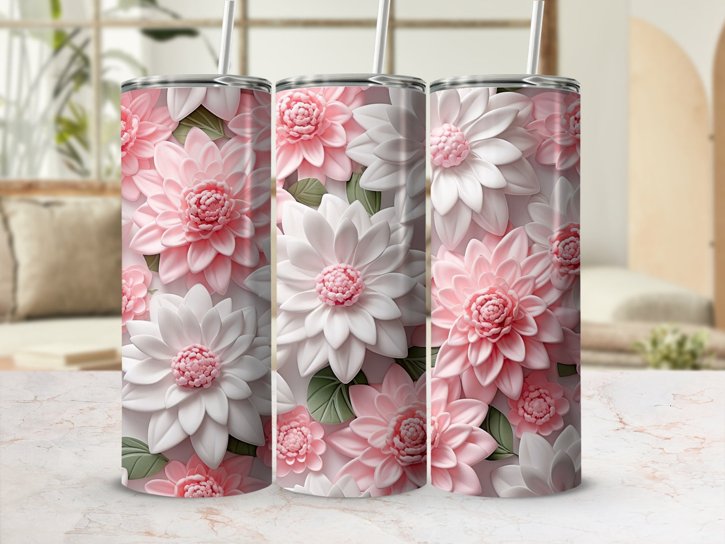 Three floral tumblers with 3D pink and white flowers on a marble surface.