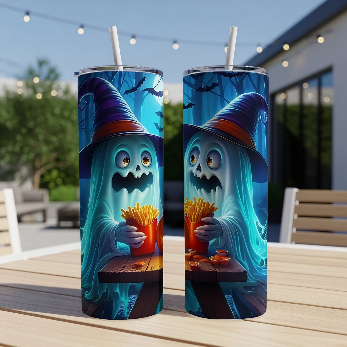 Two tumblers with cartoon ghosts in witch hats eating french fries and ketchup.