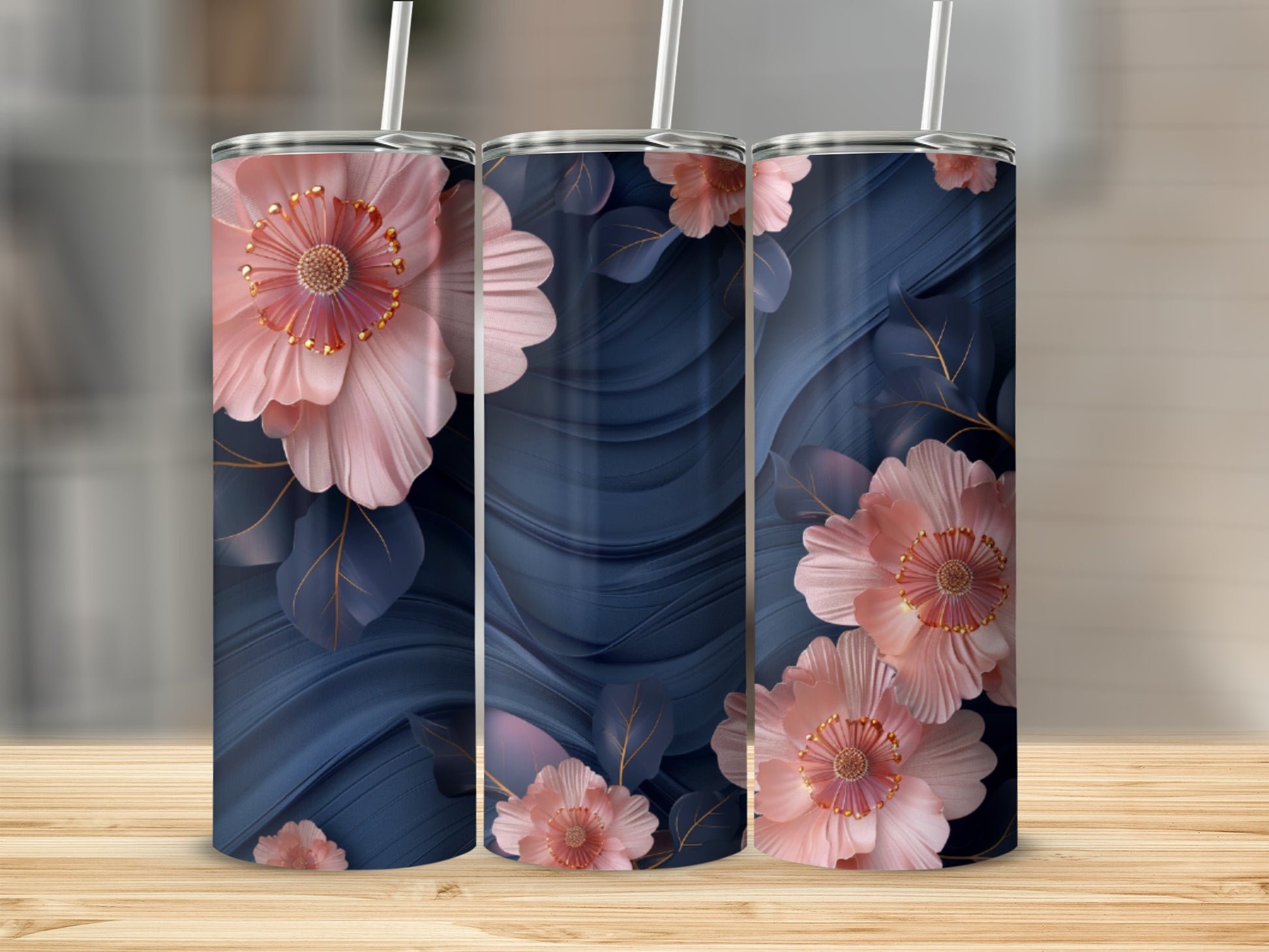Three tumblers with navy blue wavy background and pink floral designs.