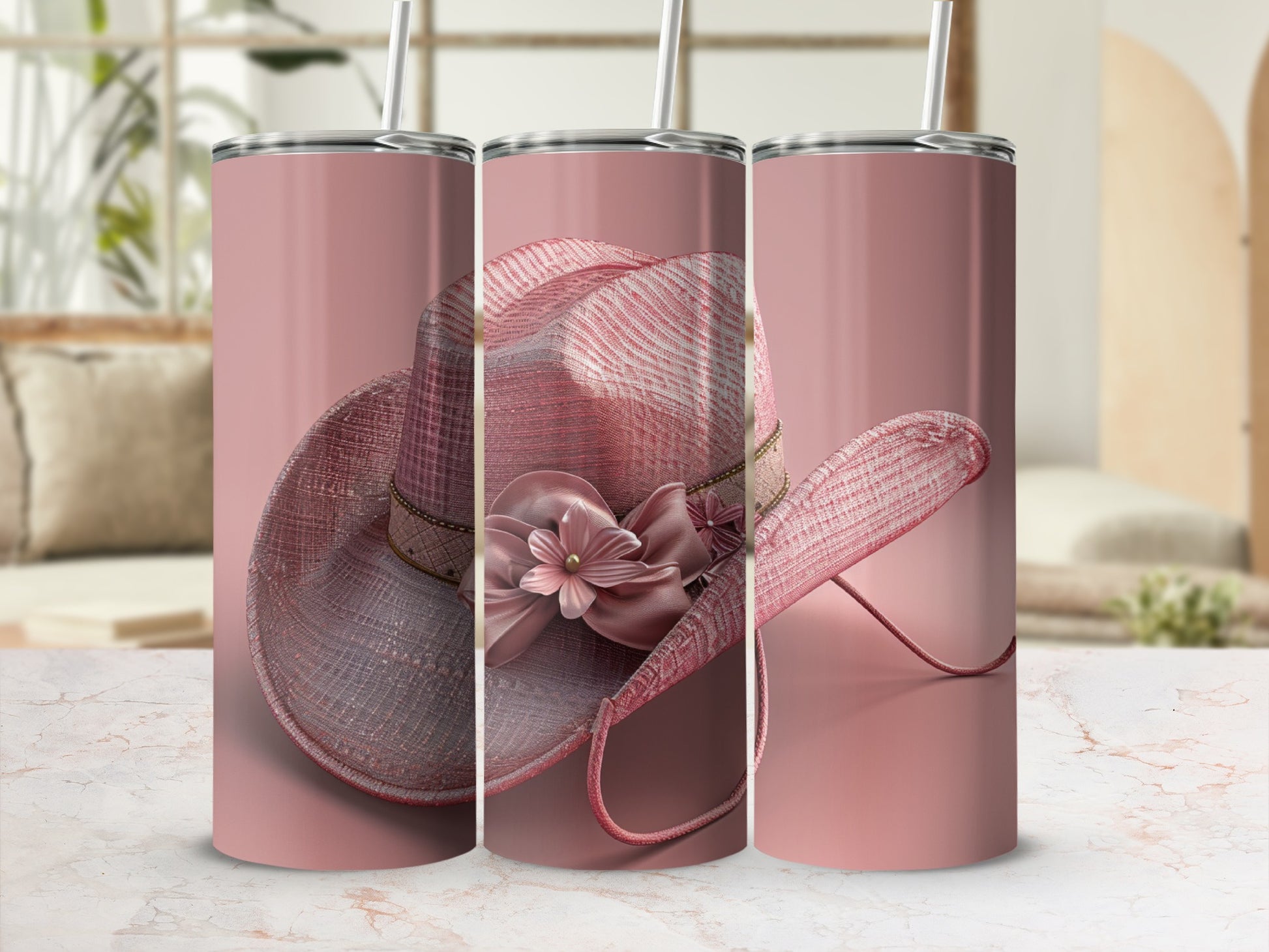 Pink cowboy hat with flower detail on a decorative tumbler.