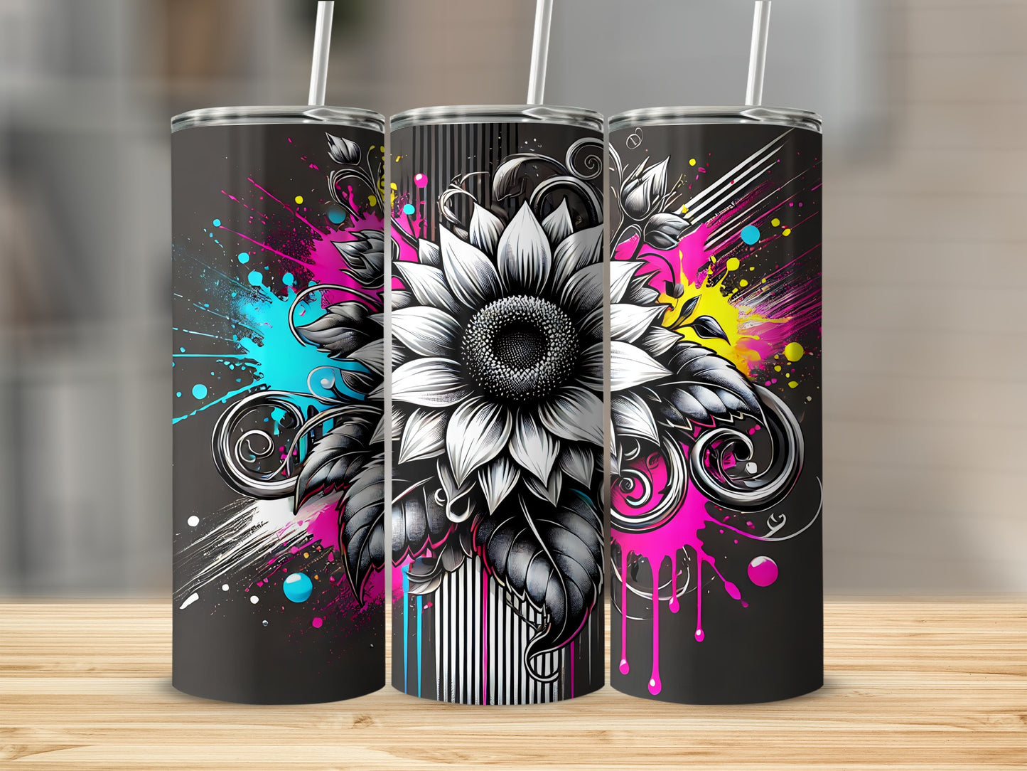 Black tumbler with a large, detailed sunflower and colorful paint splatters.