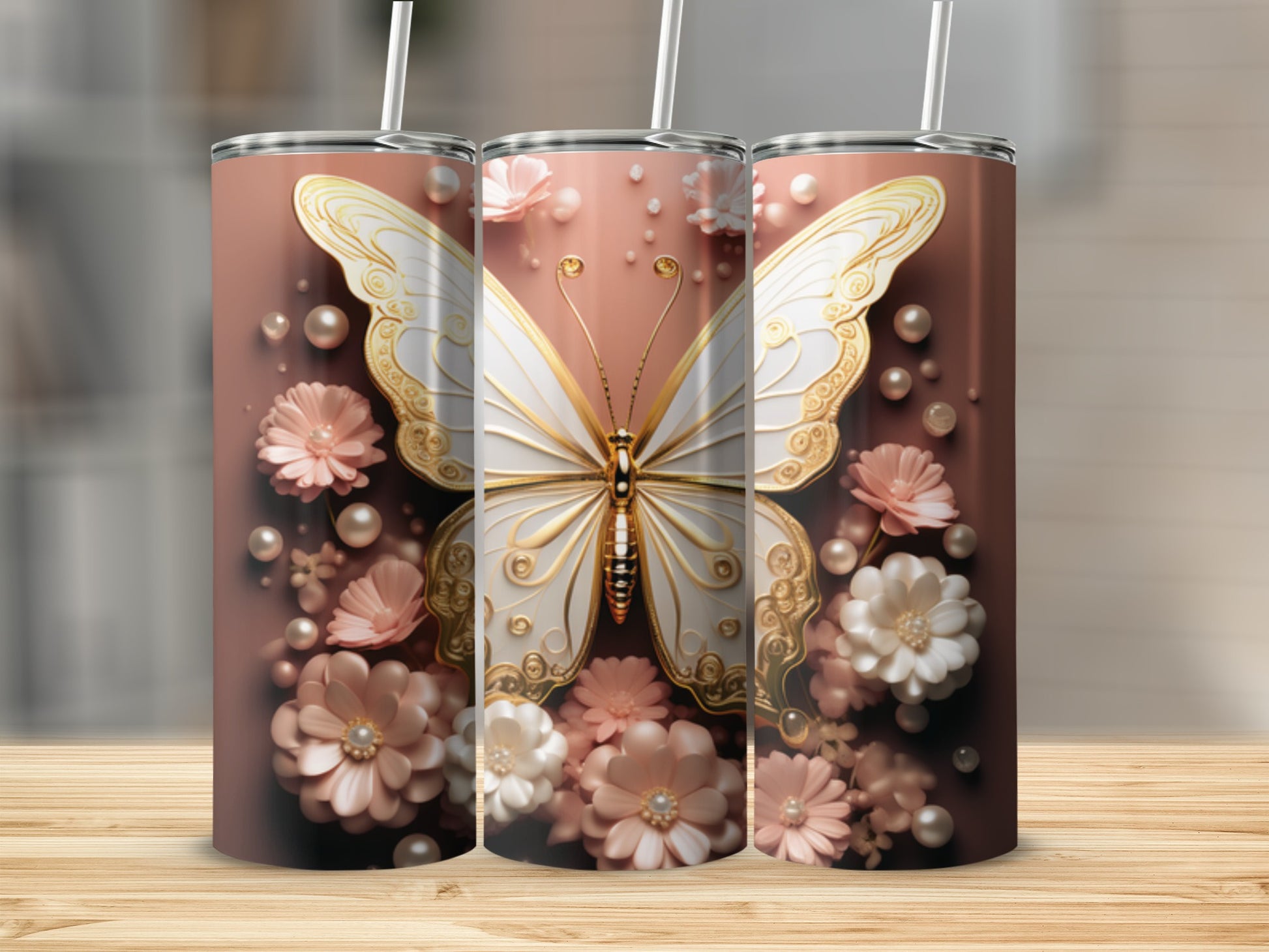 Three rose gold tumblers with a white butterfly and floral design.