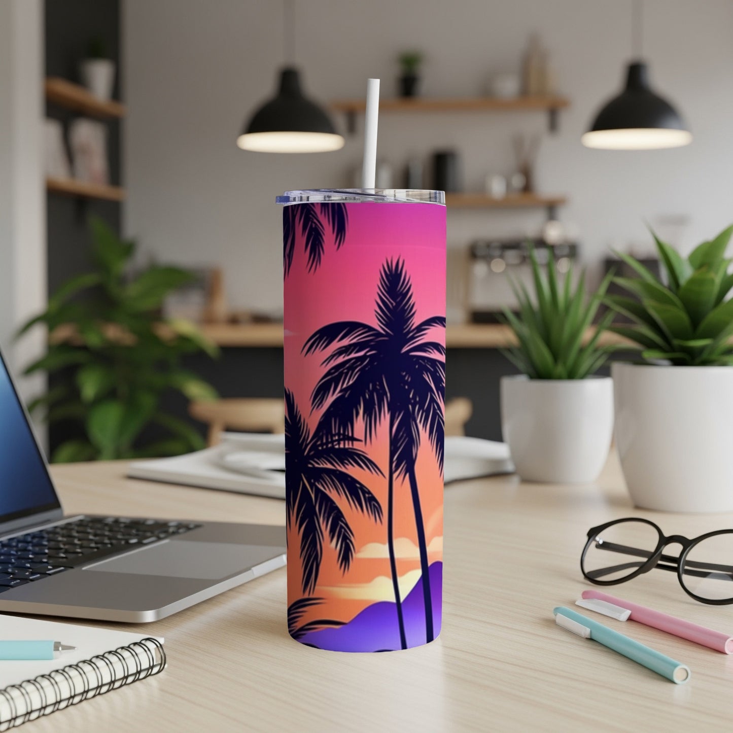 Tall tumbler with colorful sunset and palm tree silhouette design.