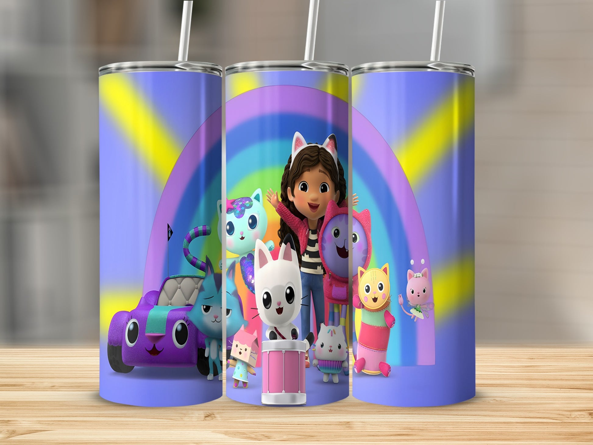 Gabby's Dollhouse characters with rainbow and car on colorful tumblers.