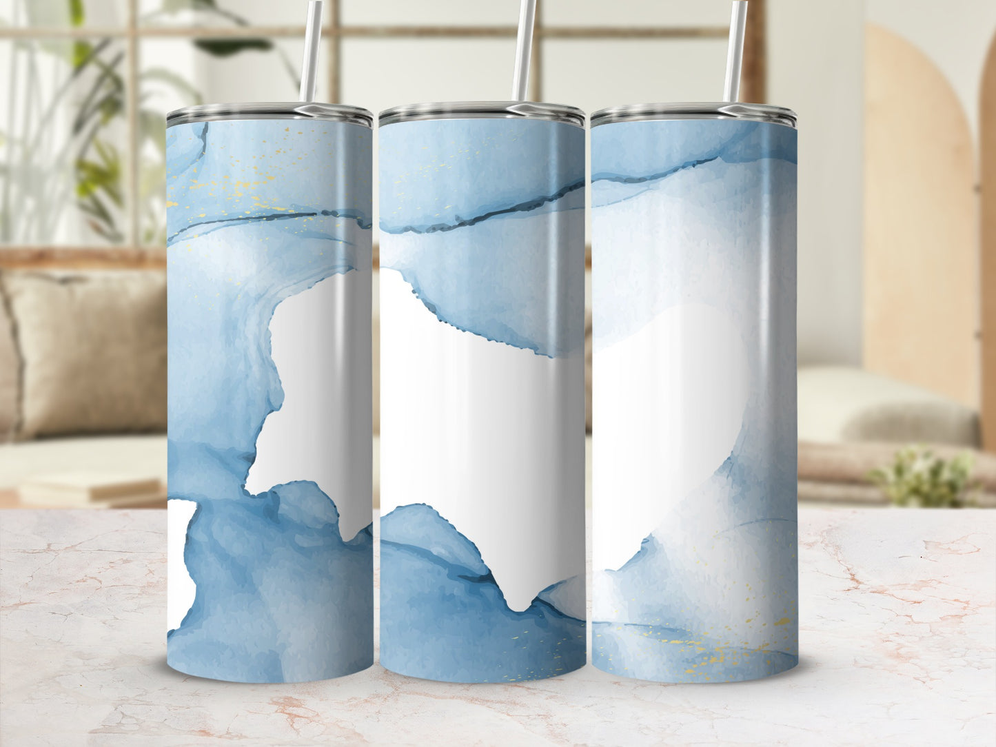 Three tumblers with abstract blue and gold watercolor patterns.