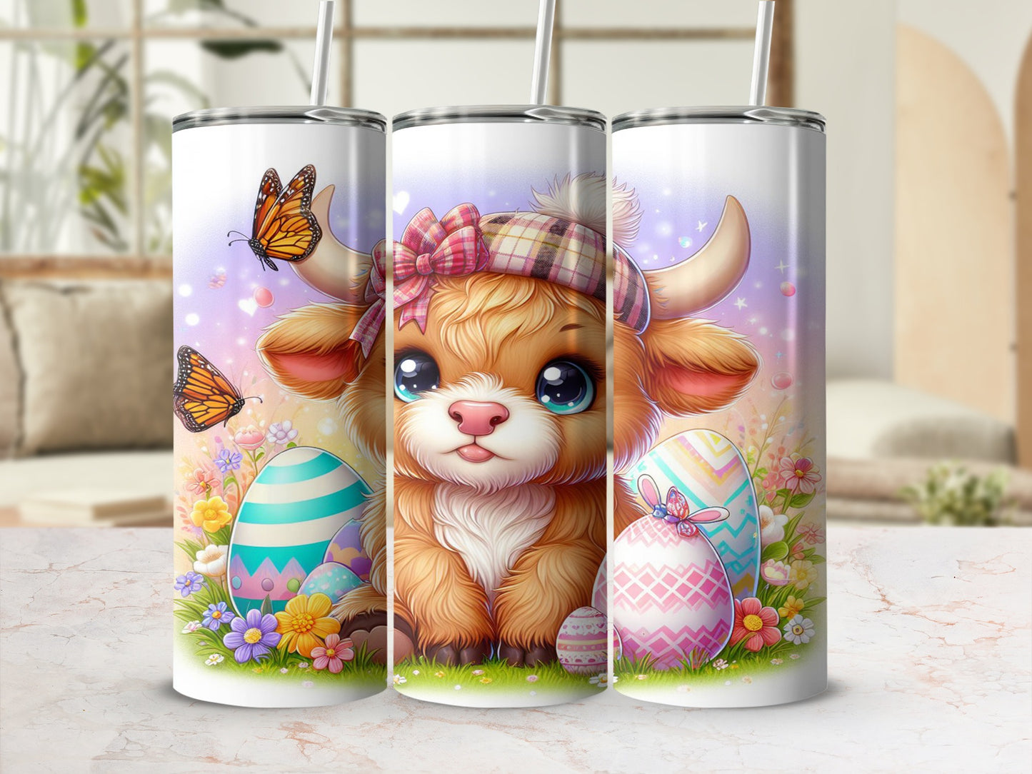 Three tumblers with a cartoon Highland cow and Easter eggs.