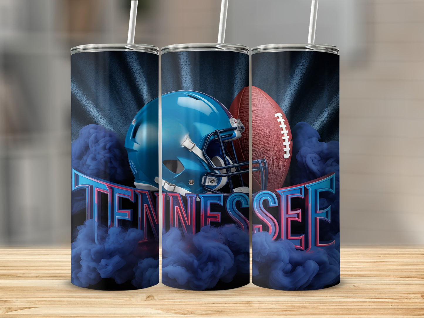 Three tumblers featuring a football helmet and "TENNESSEE" text with blue smoke.