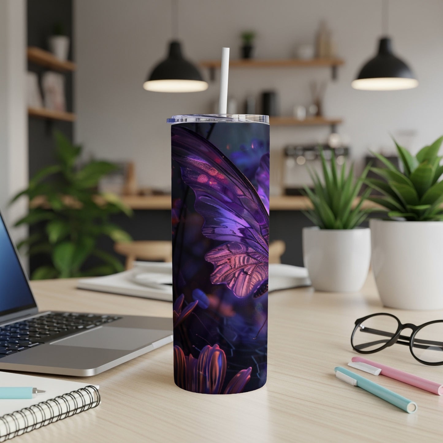 Purple butterfly design on a tall, slim tumbler with a straw.