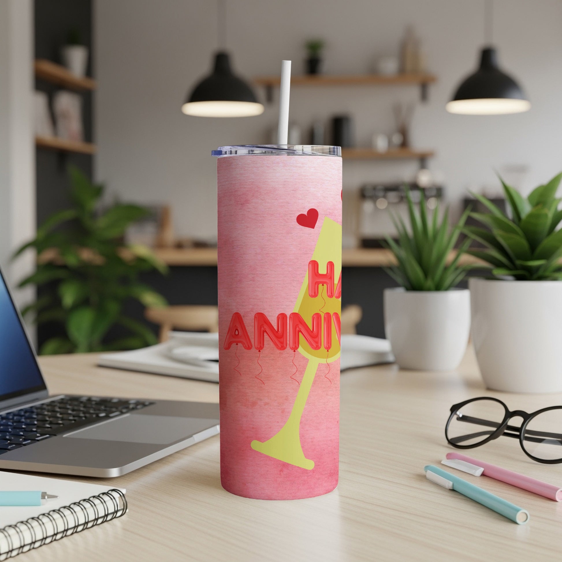 Pink tumbler with "Happy Anniversary" text and champagne glass graphic.