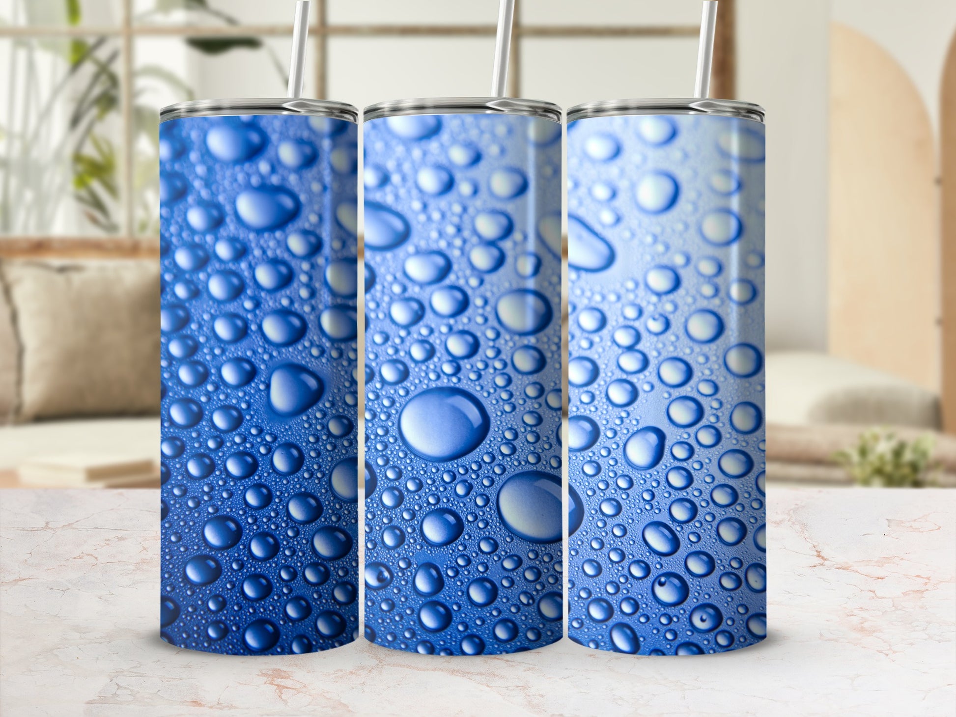 Three blue tumblers with a realistic water droplet design.