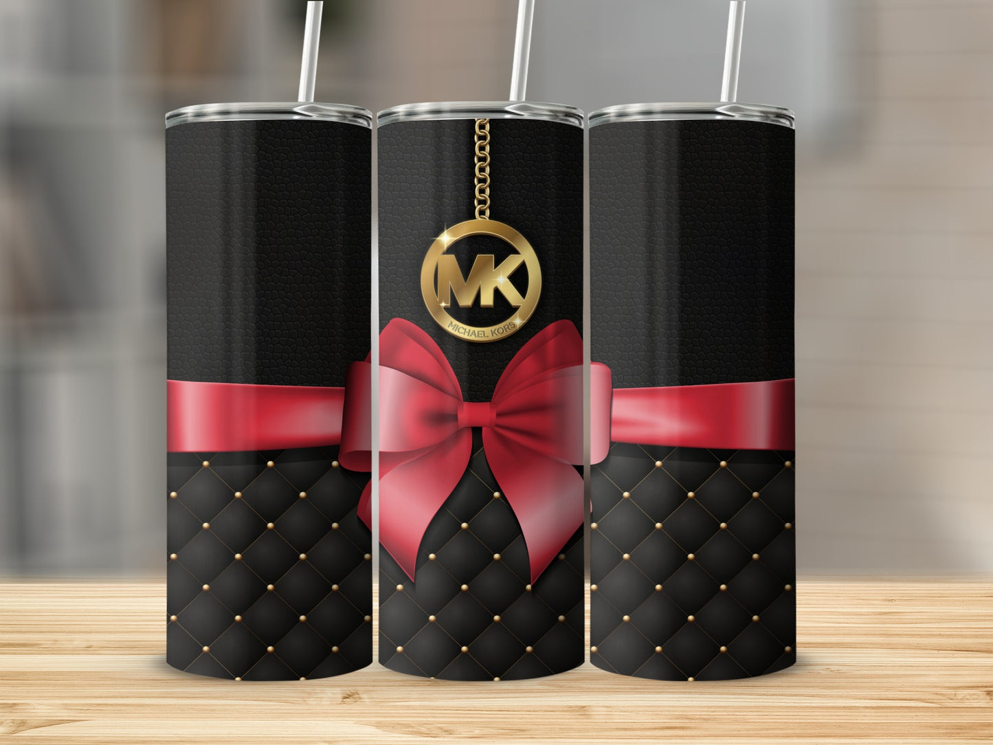 Black and Red Tumbler with Gold MK Logo and Bow Design