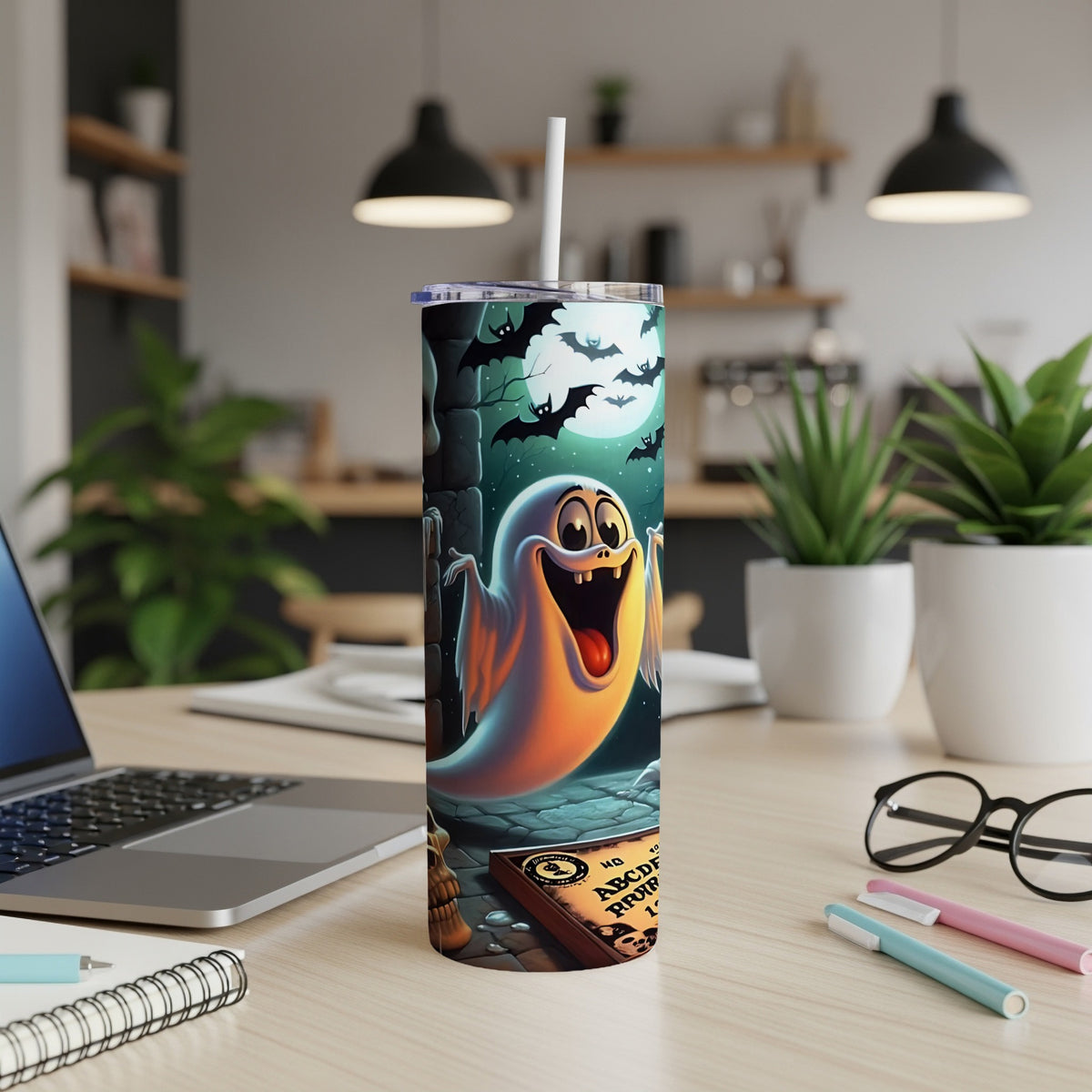 Tumbler with cartoon ghost, bats, and Ouija board Halloween design.