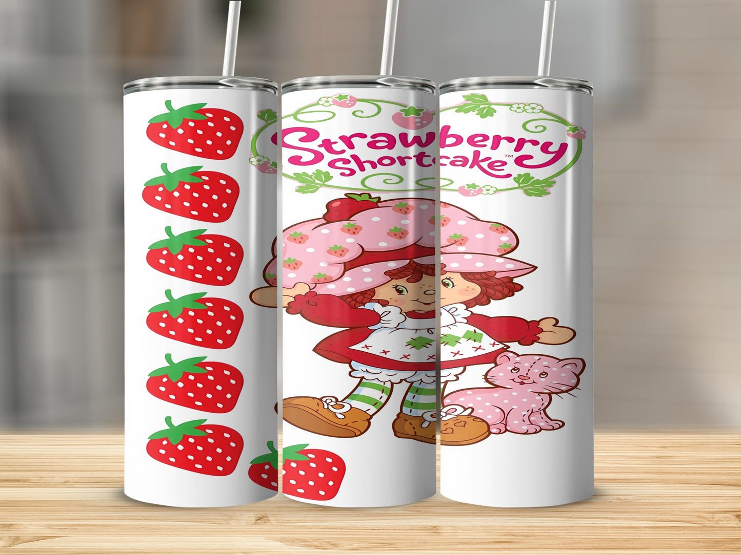 Strawberry Shortcake character and cat on a patterned tumbler.