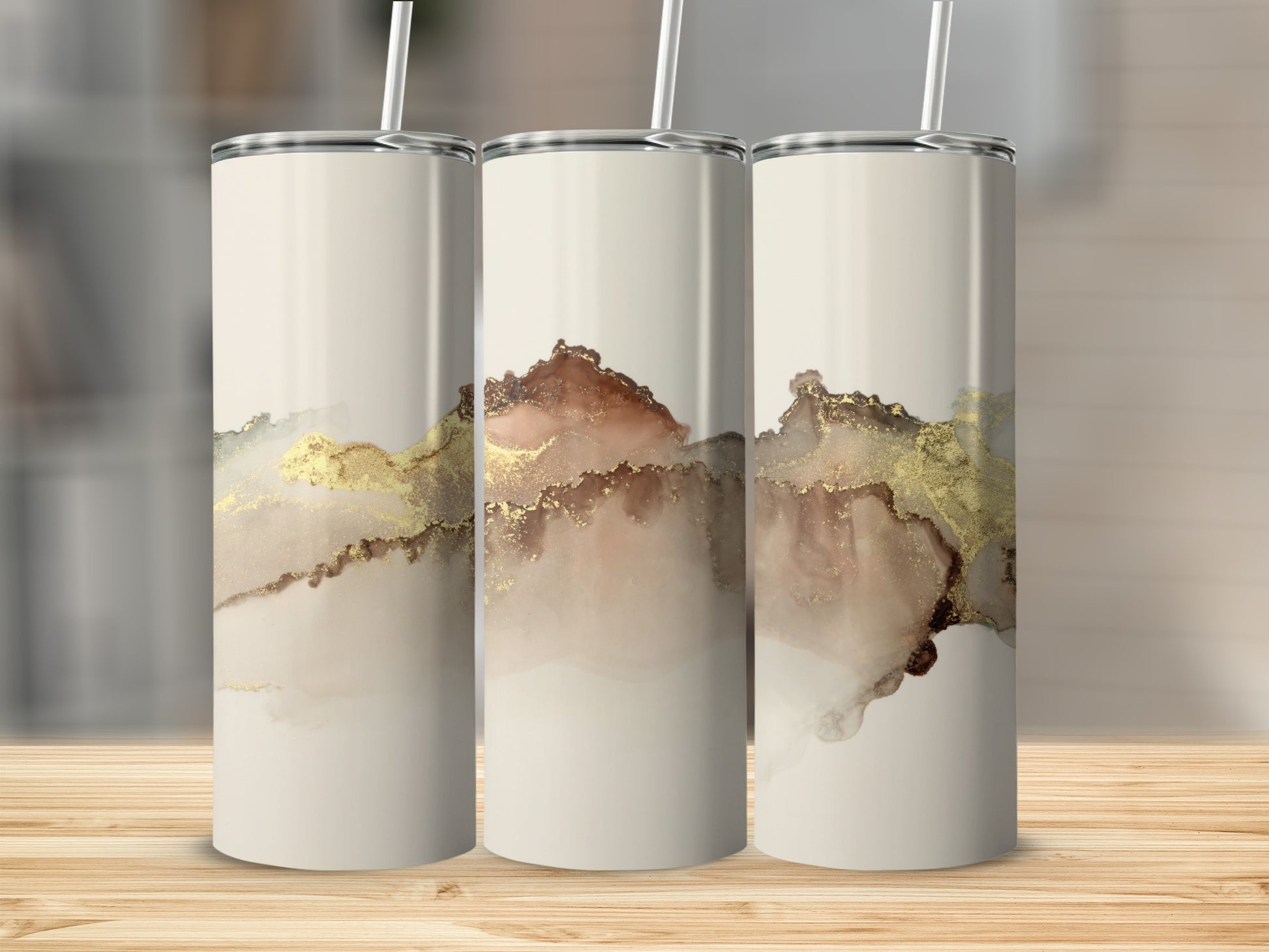Three tumblers with abstract gold and brown watercolor design.