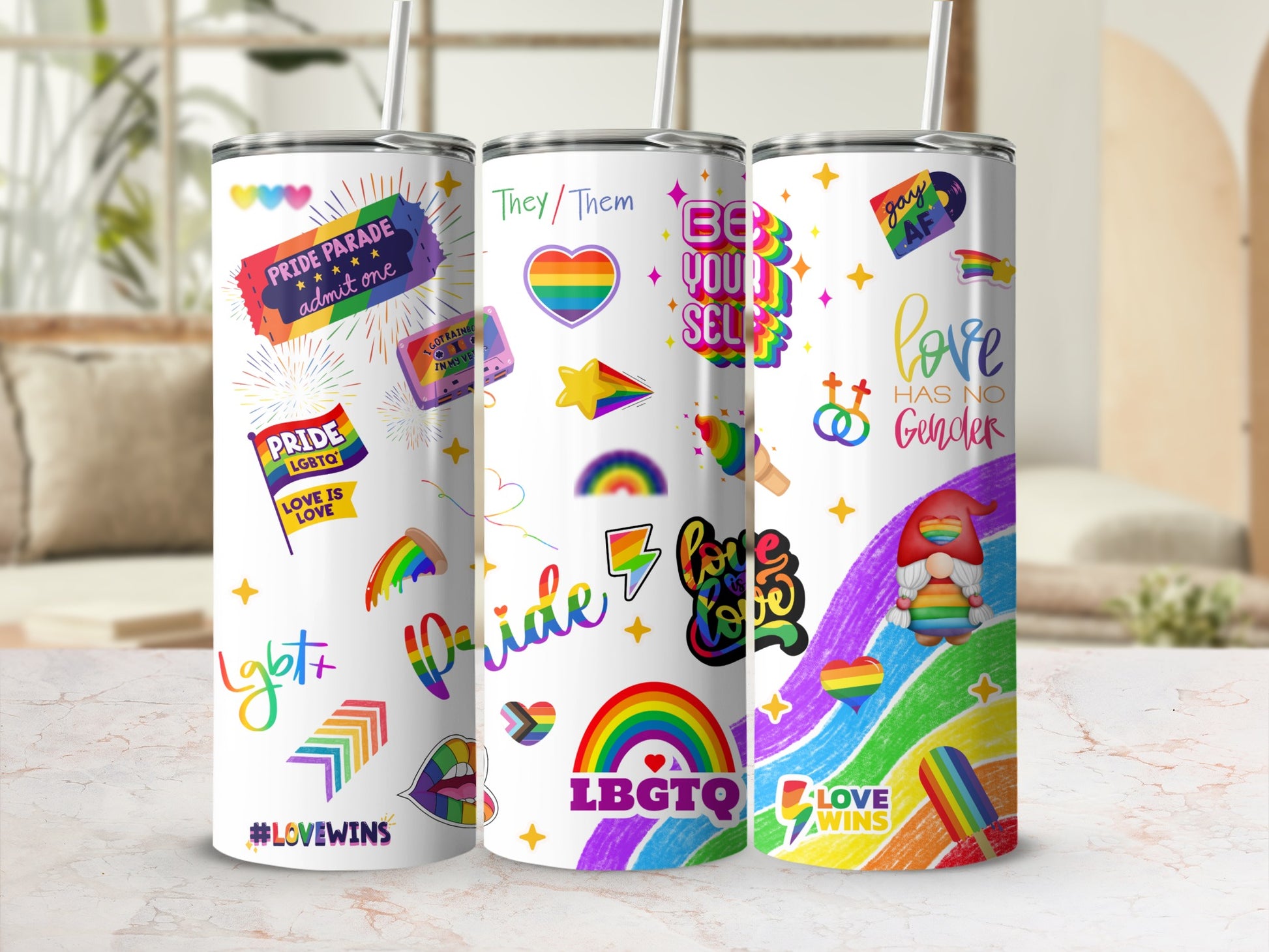 Tumbler with LGBTQ+ pride designs, rainbows, hearts, and text including "Love Wins."