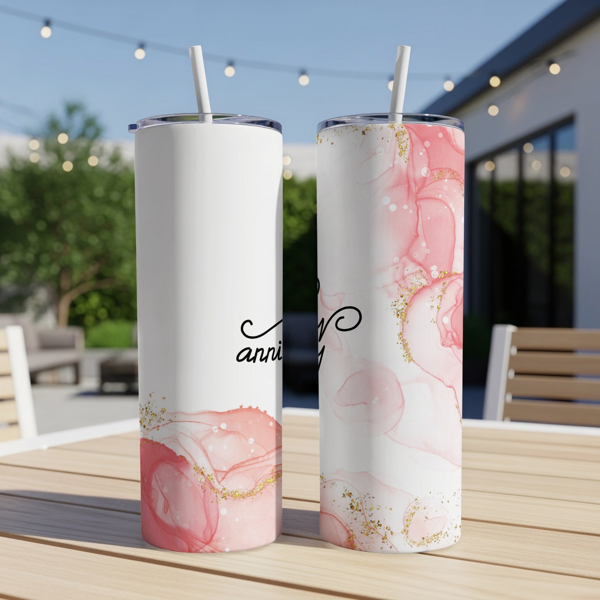 Two white tumblers with pink marble design and "anniversary" text.