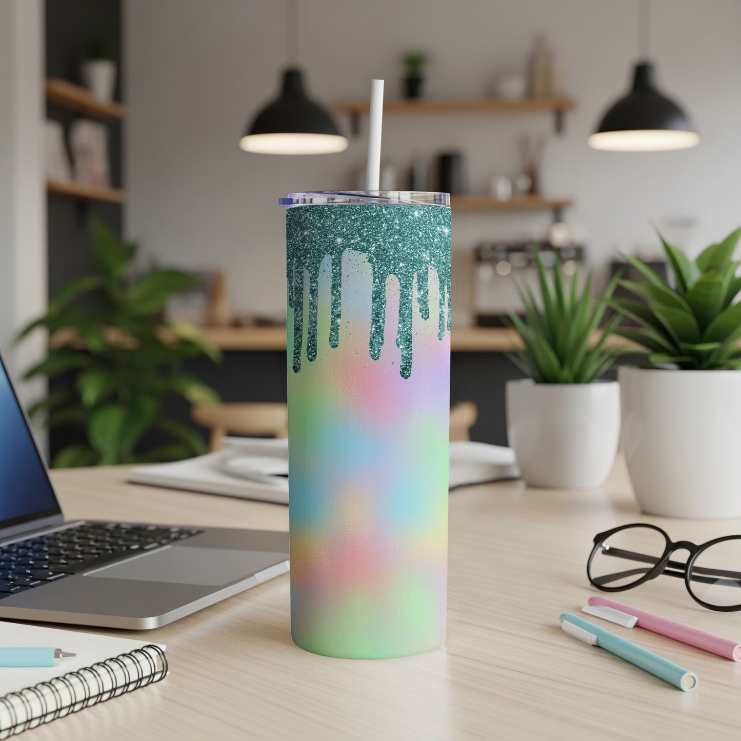 Glitter-dipped tumbler with pastel tie-dye pattern and straw.