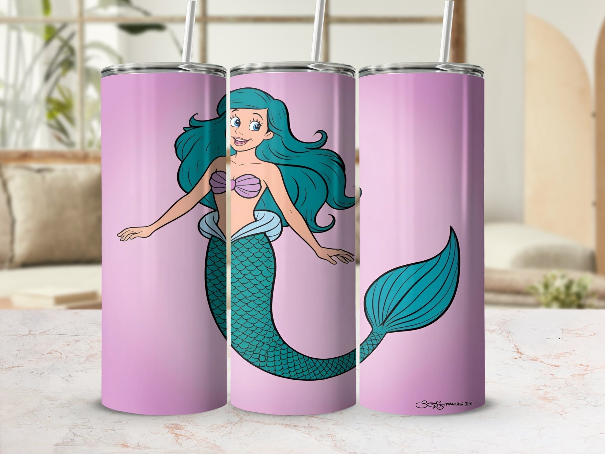 Pink tumbler with a cartoon mermaid and her tail against a light pink background.