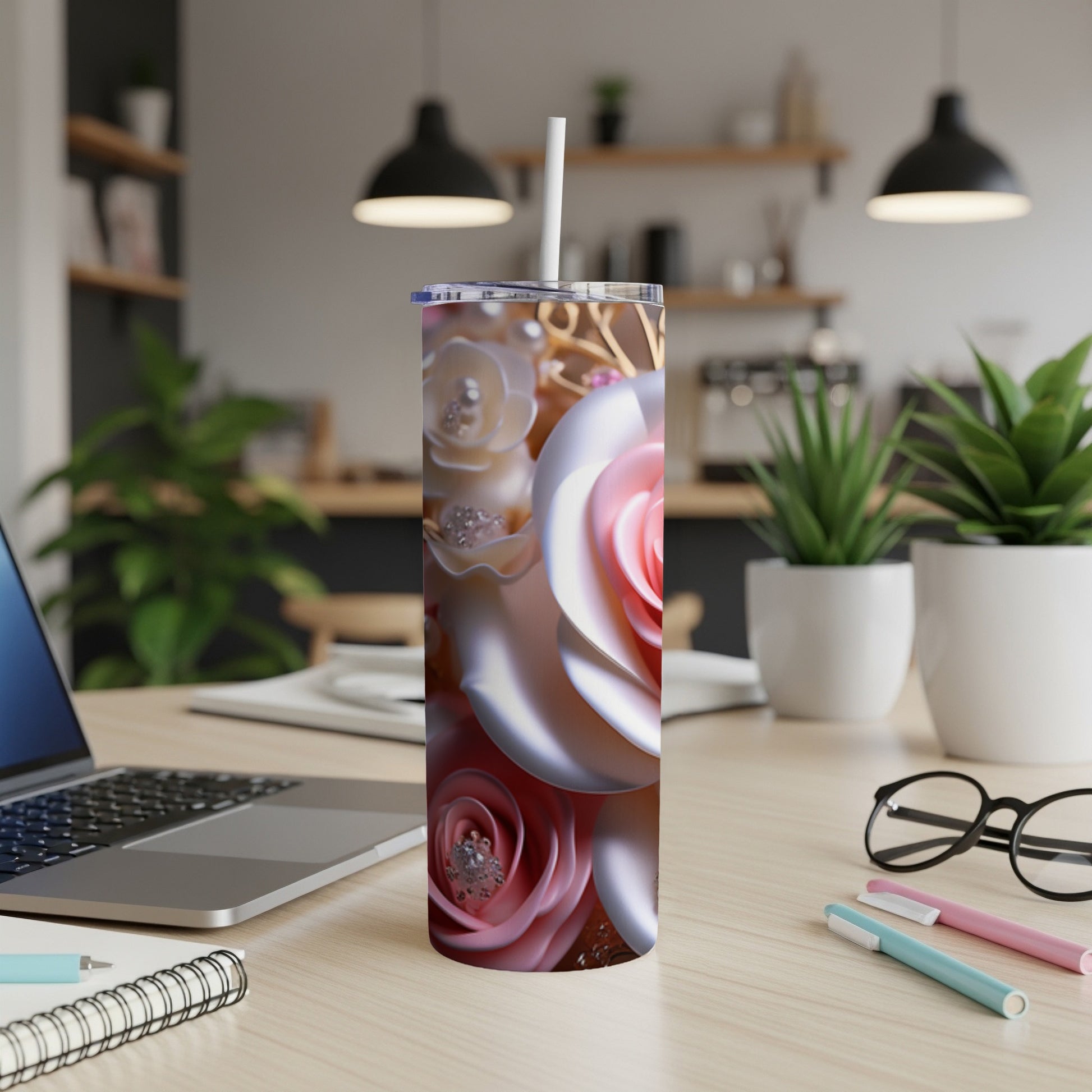 3D pink and white rose design on a skinny tumbler with a white straw.