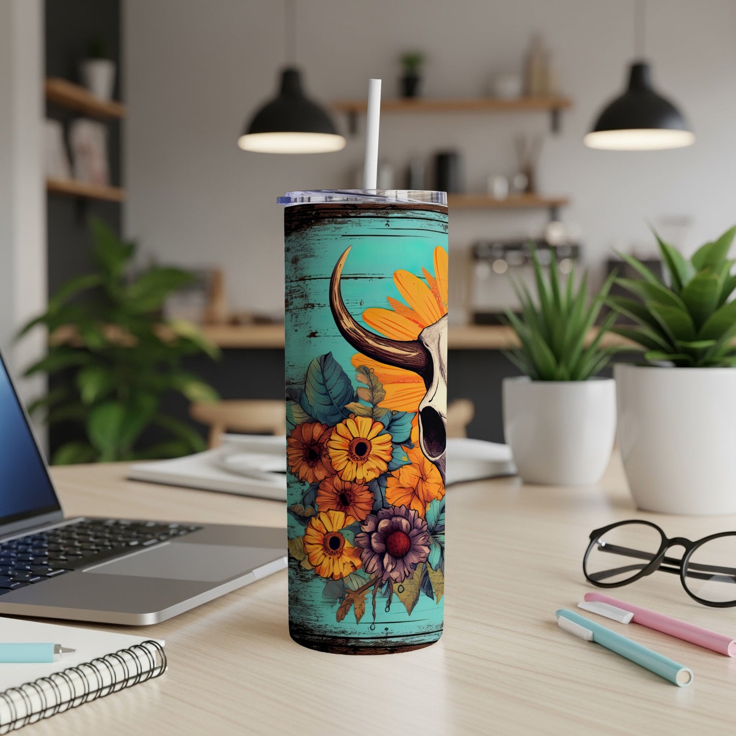 Teal tumbler with bull skull and sunflowers design.