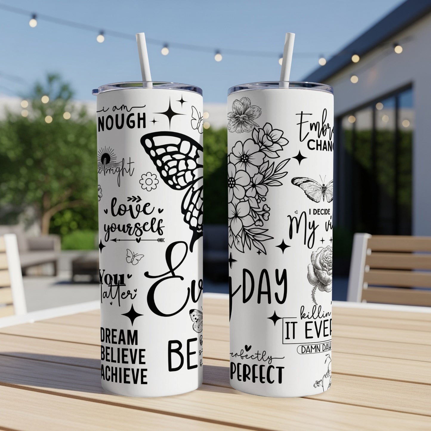 Black and white tumbler with inspirational quotes and butterfly designs.