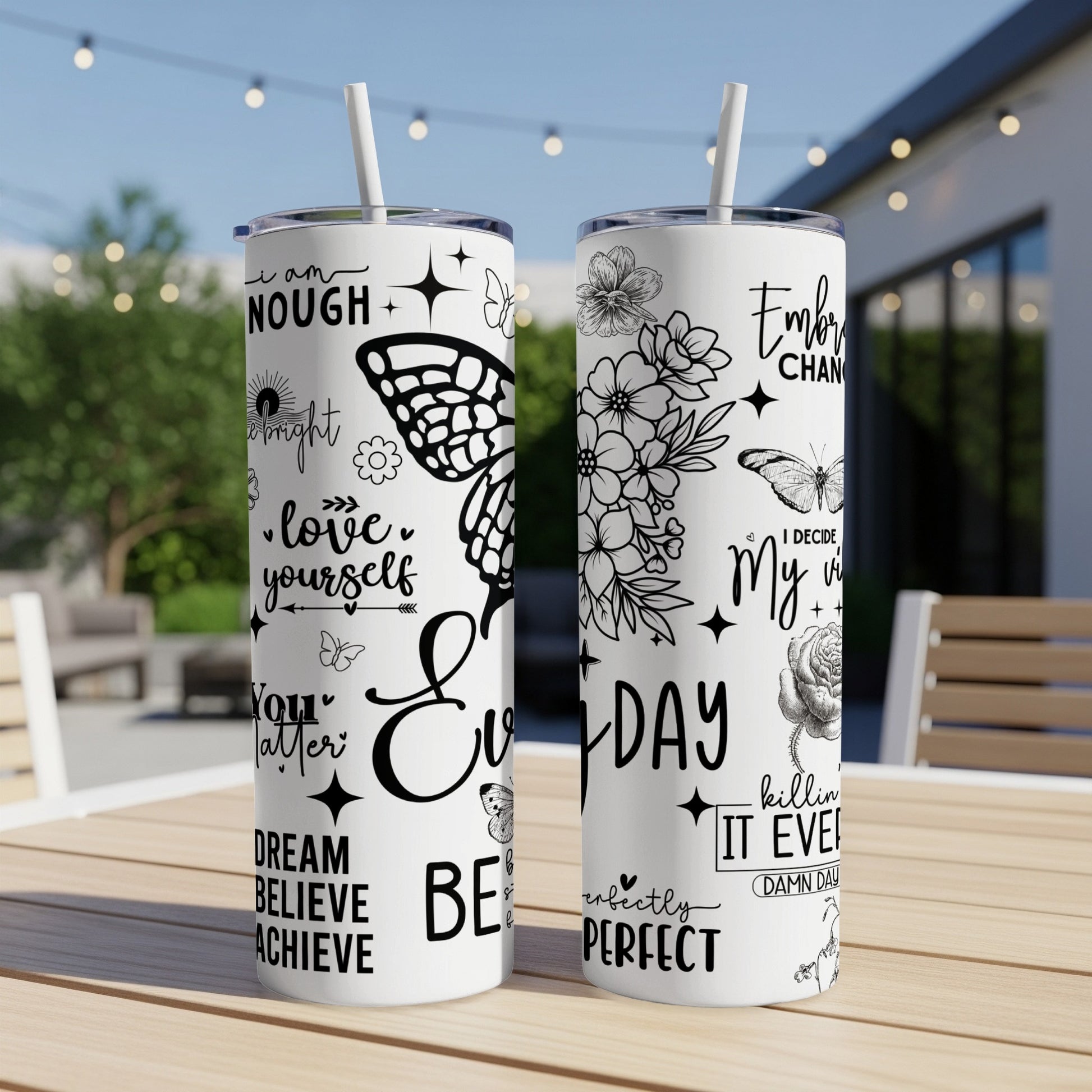 Black and white tumbler with inspirational quotes and butterfly designs.