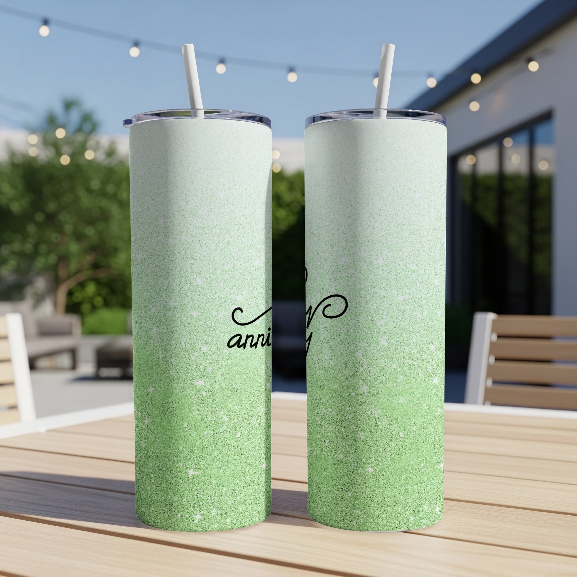 Green glitter gradient tumbler with "anniversary" script.