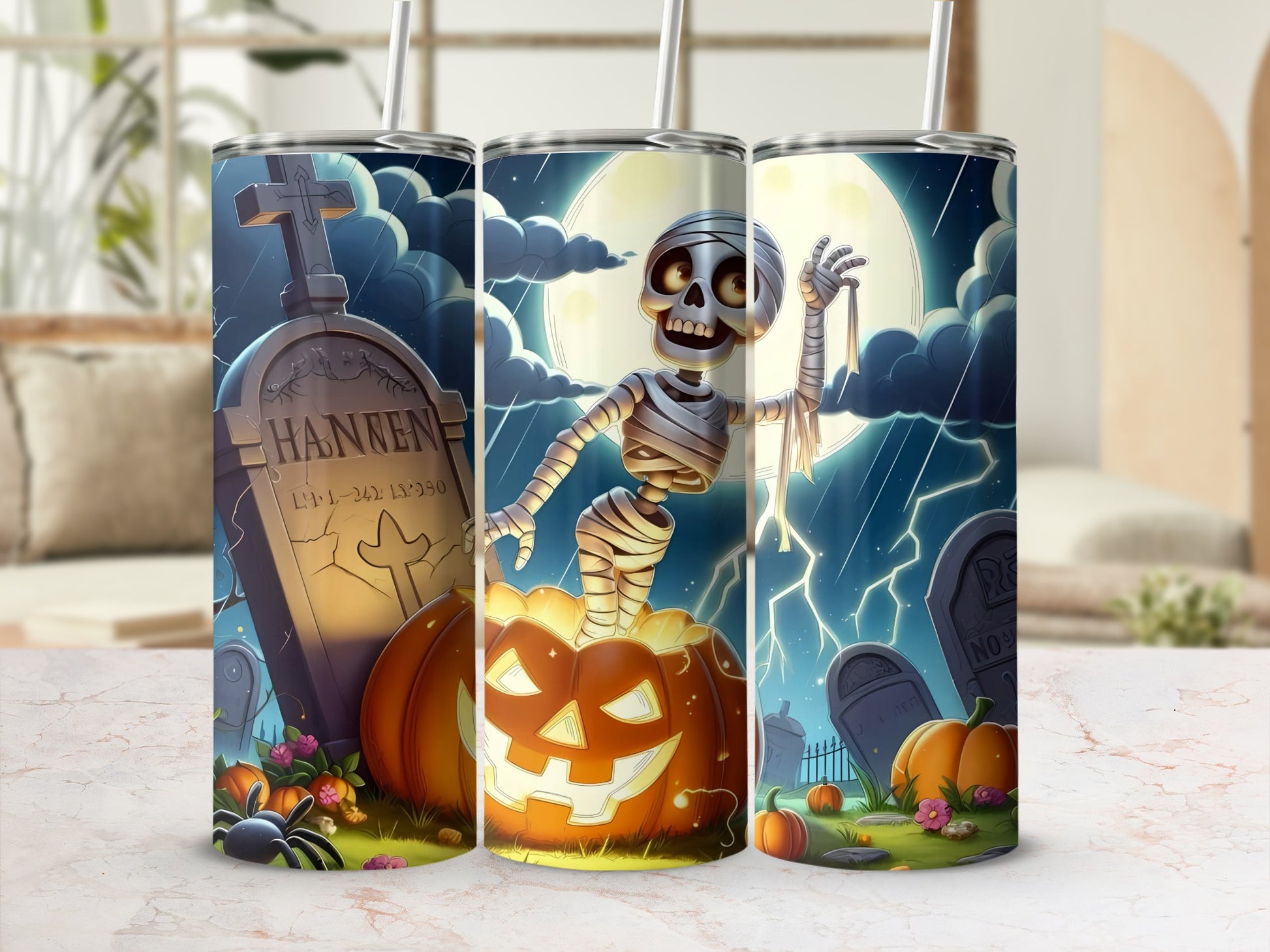 Halloween tumblers with skeleton, mummy, tombstone, and pumpkin designs.