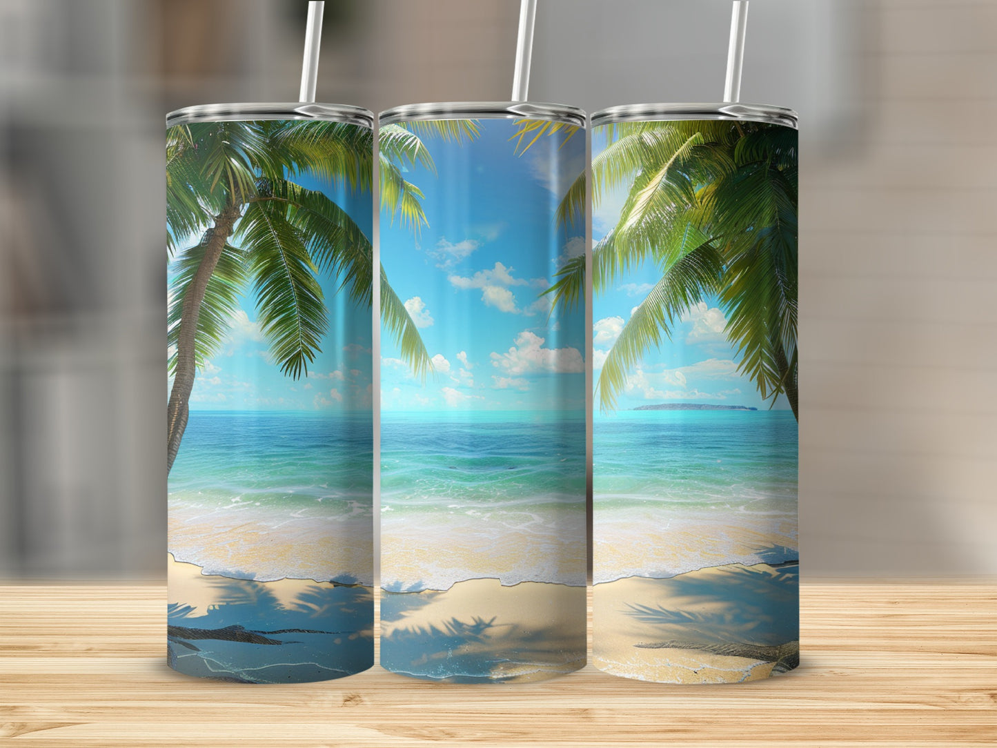 Beach scene with palm trees and ocean on three tumblers.