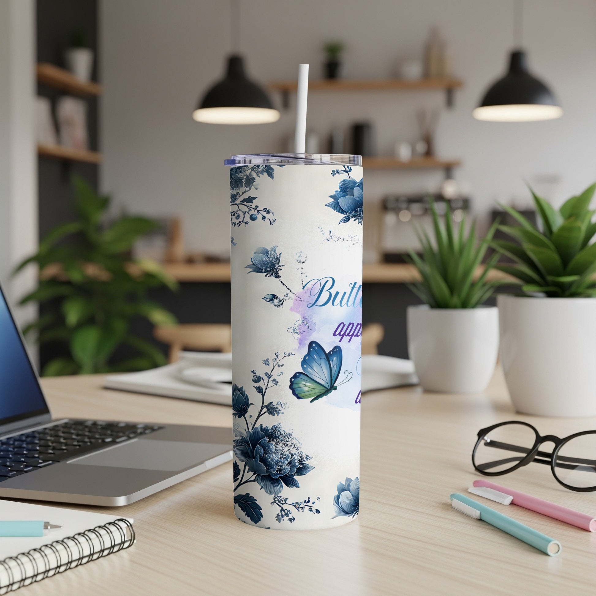 Blue floral tumbler with butterfly and "Butterfly" text.