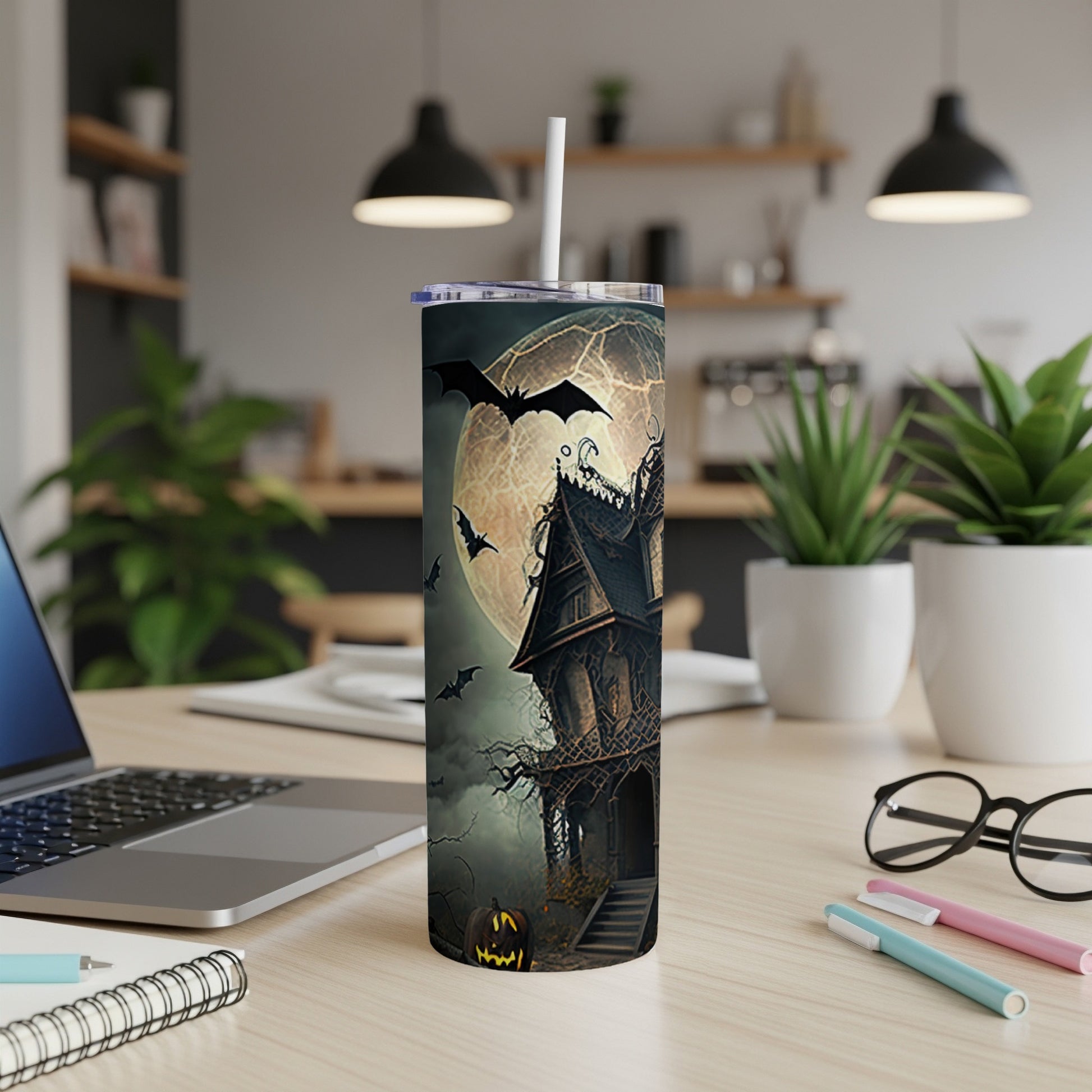 Halloween tumbler with haunted house, bats, full moon, and jack-o'-lantern.