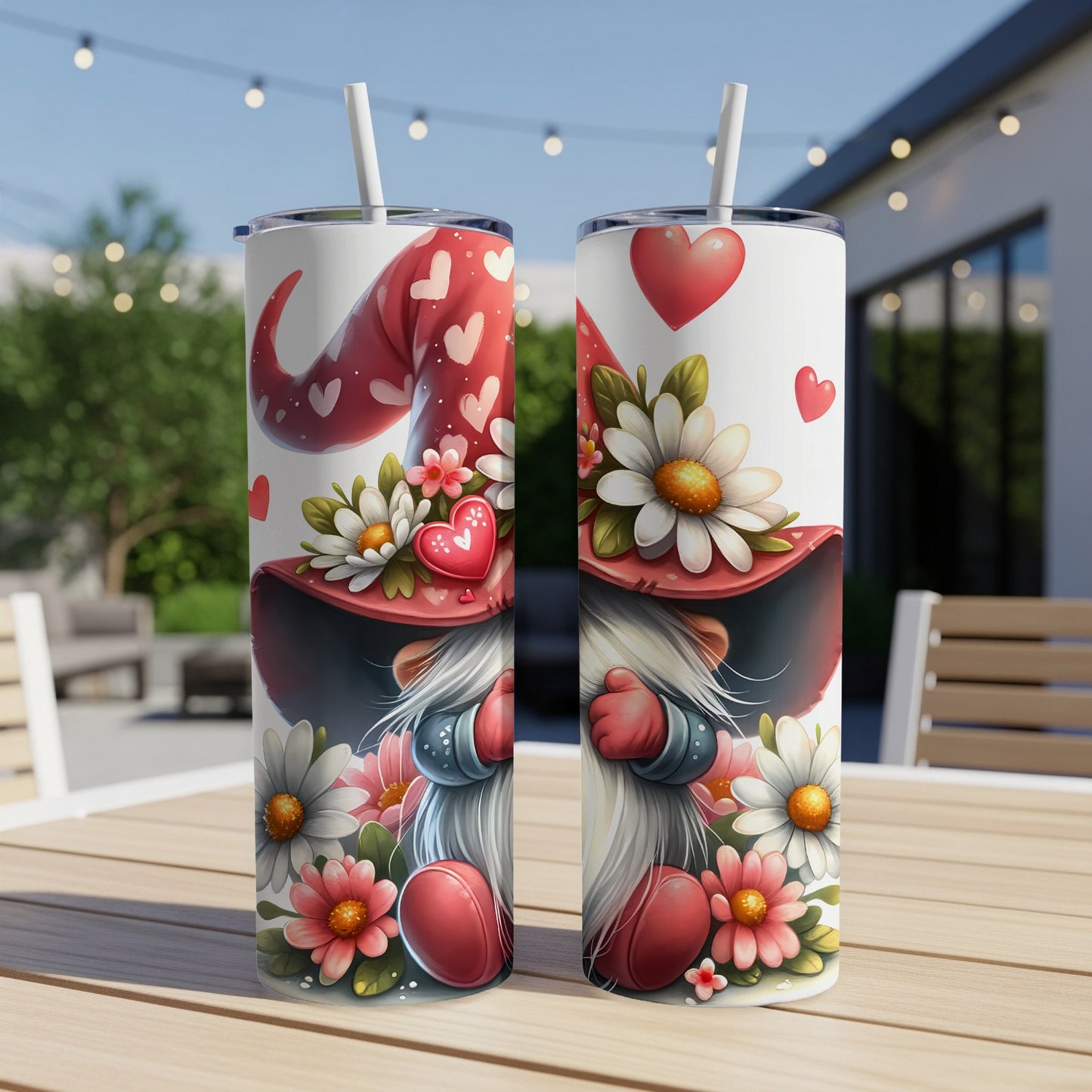 Two Valentine's Day themed gnomes on tumblers with flowers and hearts.