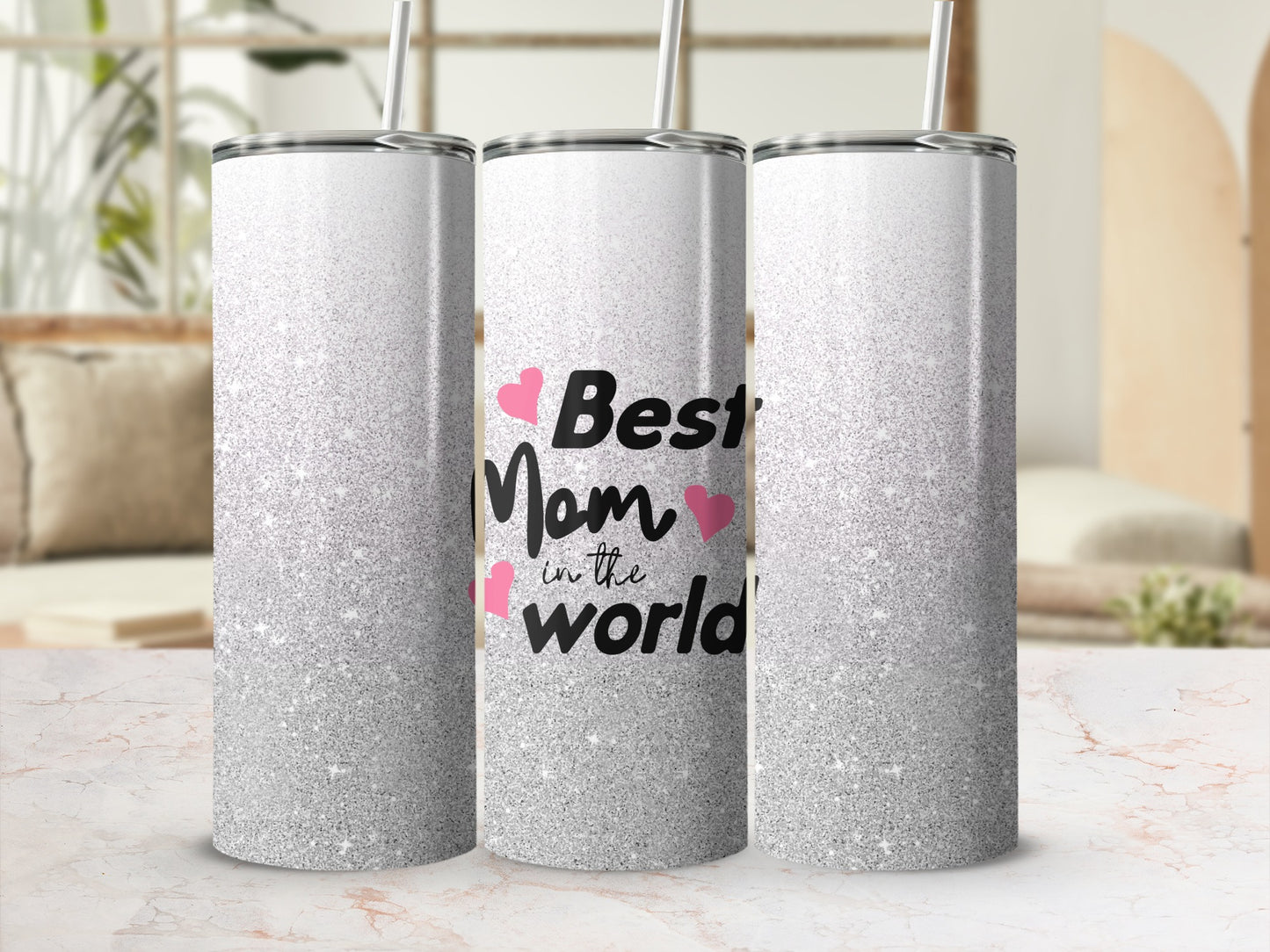 Silver glitter tumbler with "Best Mom" text and pink hearts.