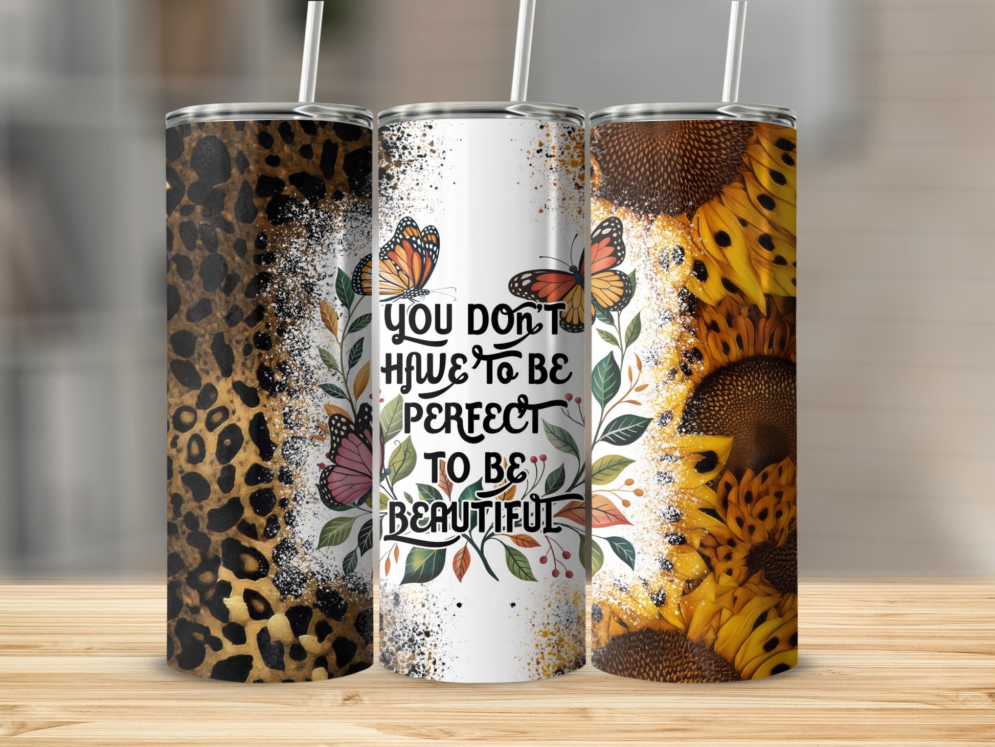 Three tumblers with leopard print, sunflowers, and inspirational text.