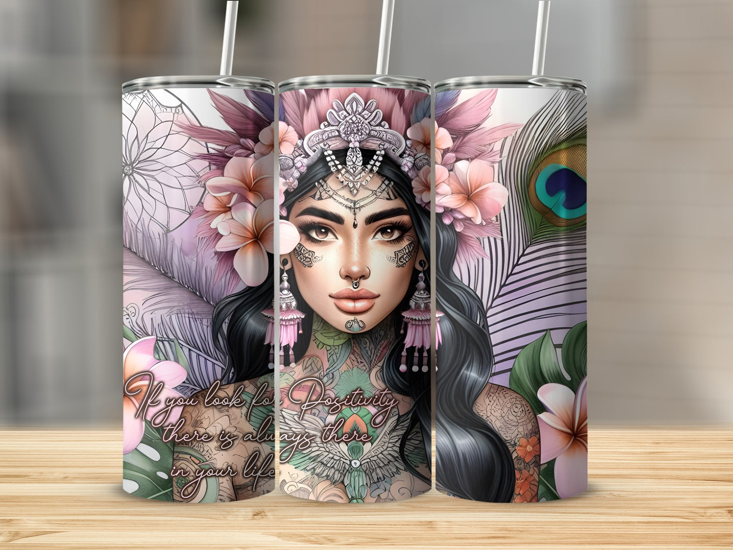 Three skinny tumblers featuring a woman with floral headdress and peacocks.