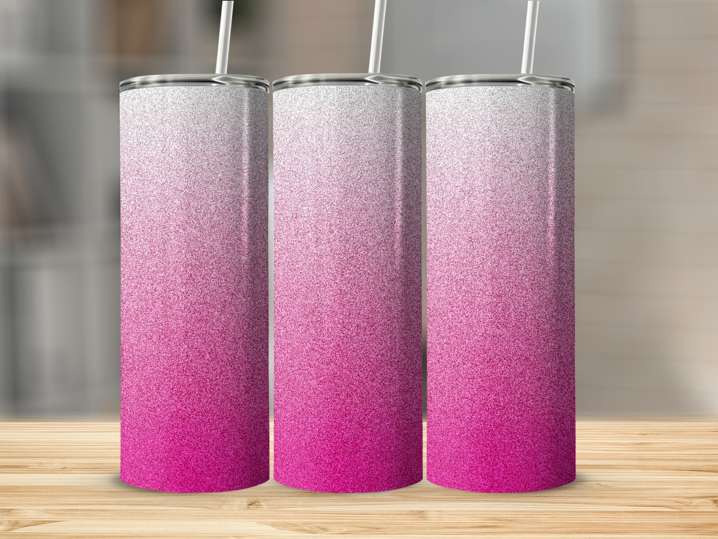 Three tall, slender tumblers with a pink to white glitter gradient.
