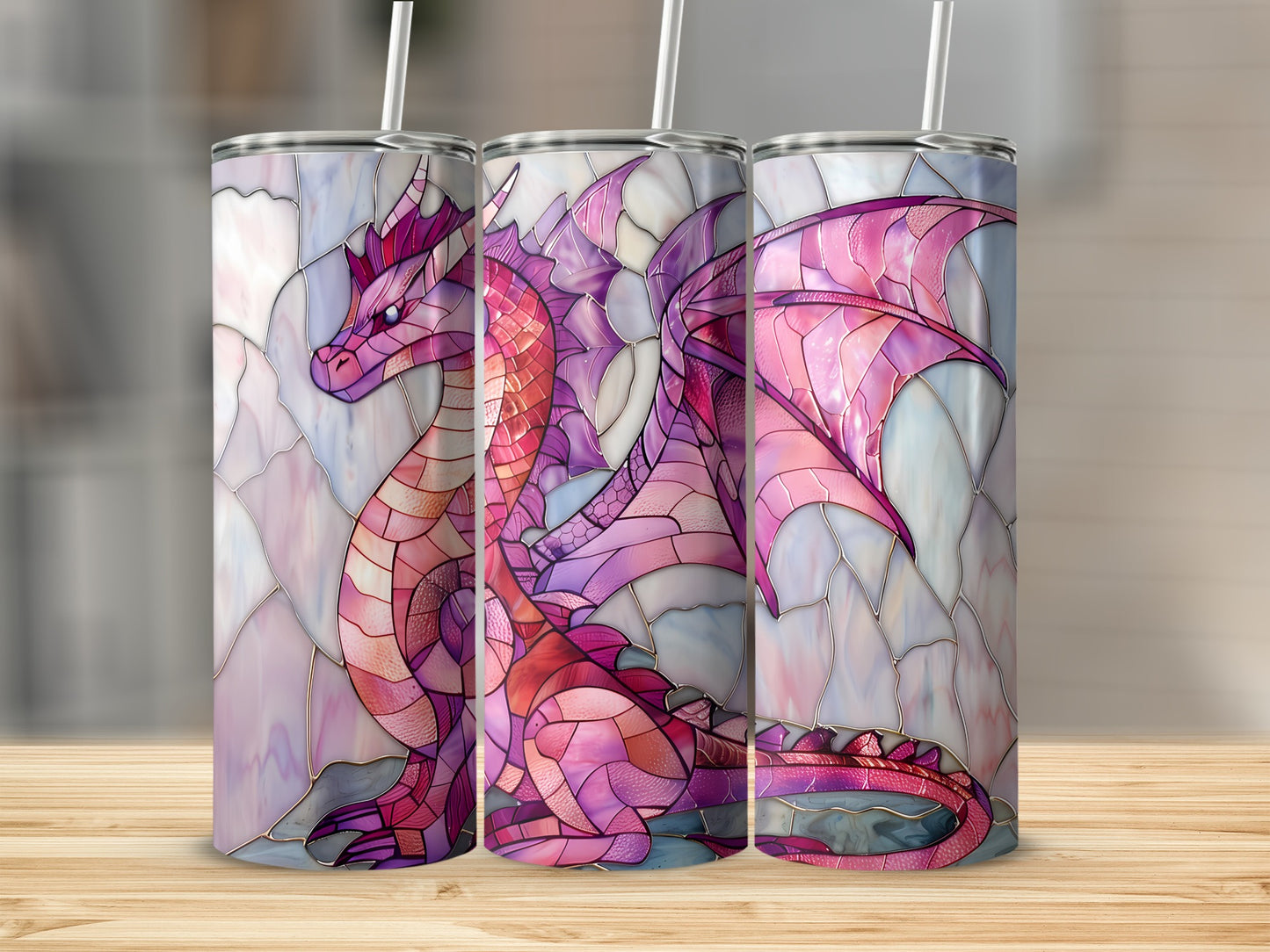 Stained glass dragon design on three tall tumblers with straws.