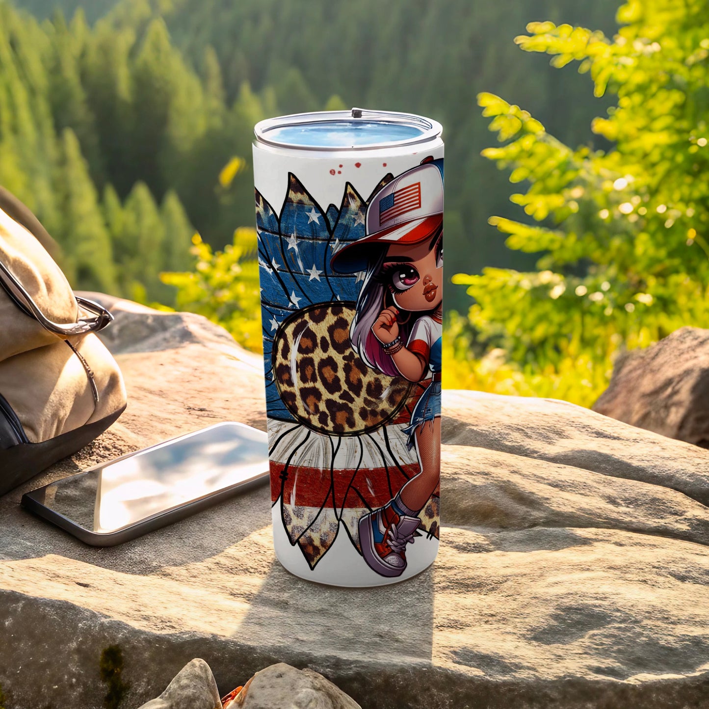 Tumbler with patriotic girl design and American flag, set outdoors.