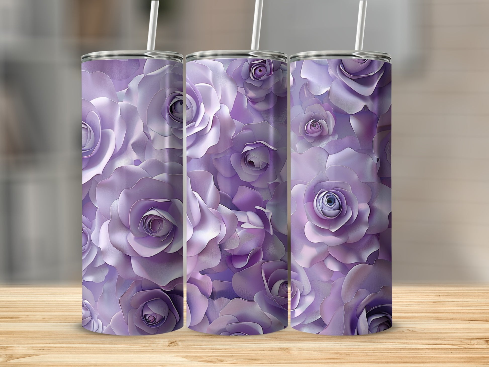 Three tumblers with a purple rose floral design sit on a wooden surface.